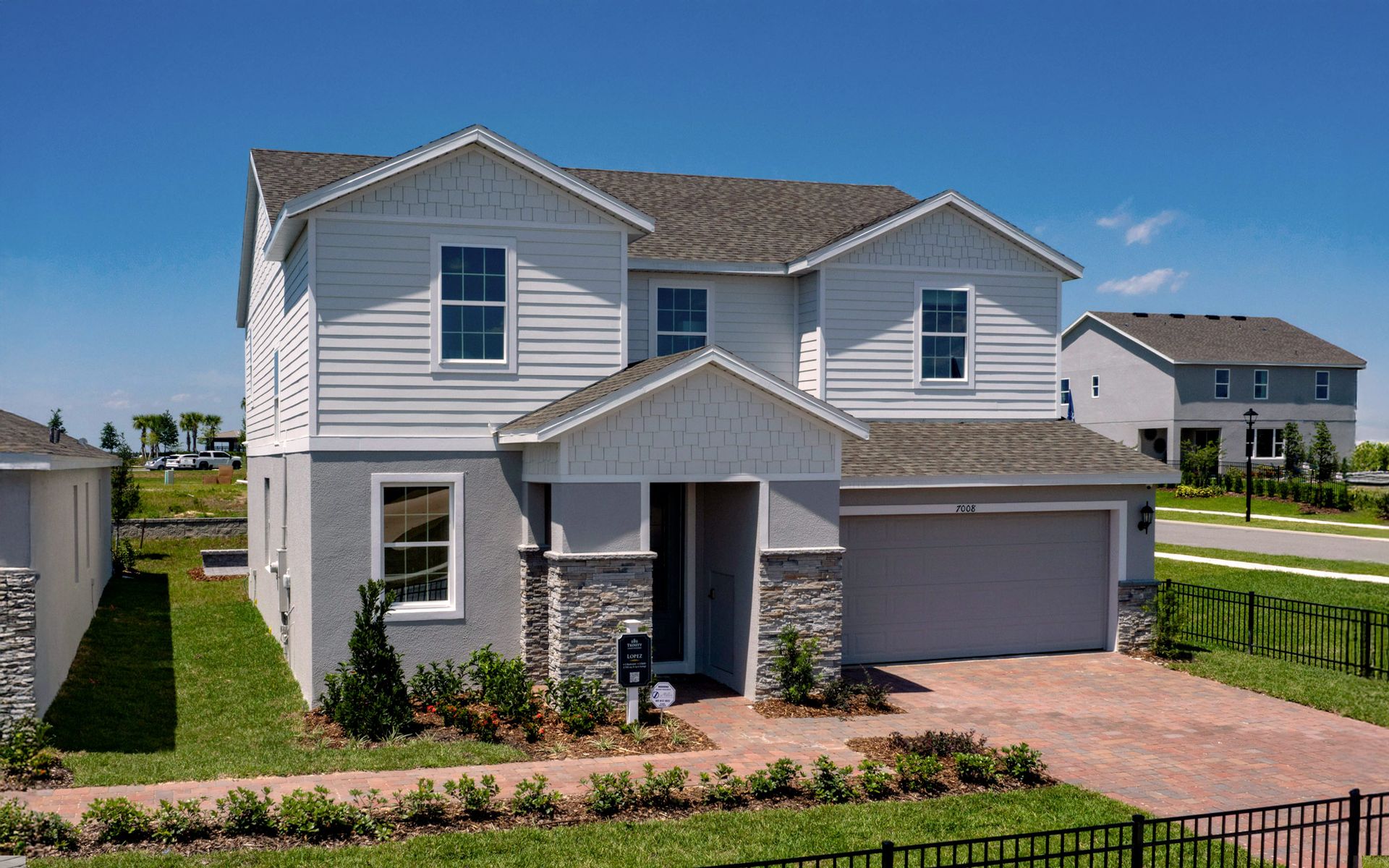 Lopez elevation 3 shown with optional stone (3rd car garage not shown)
