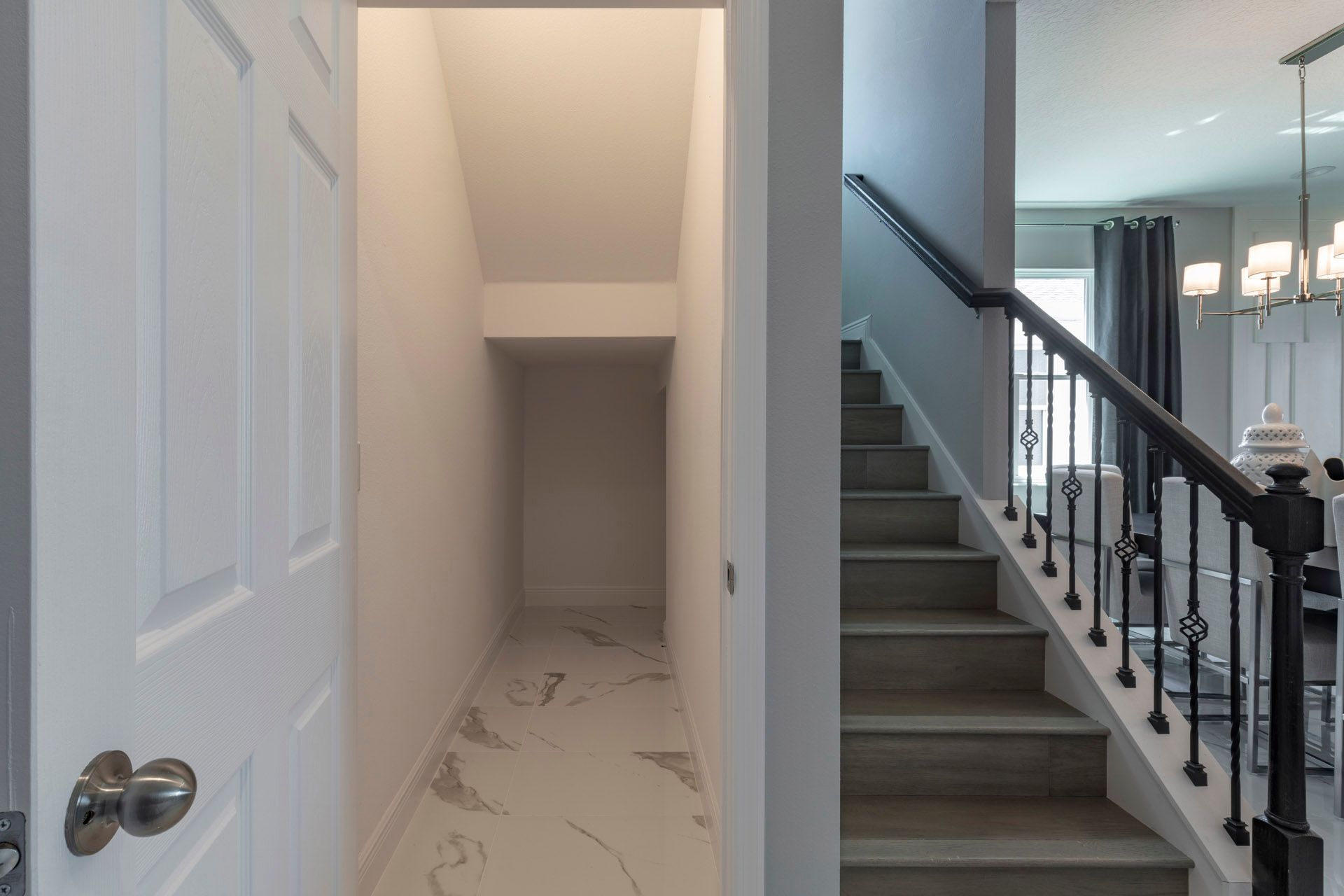 Lopez under stairs