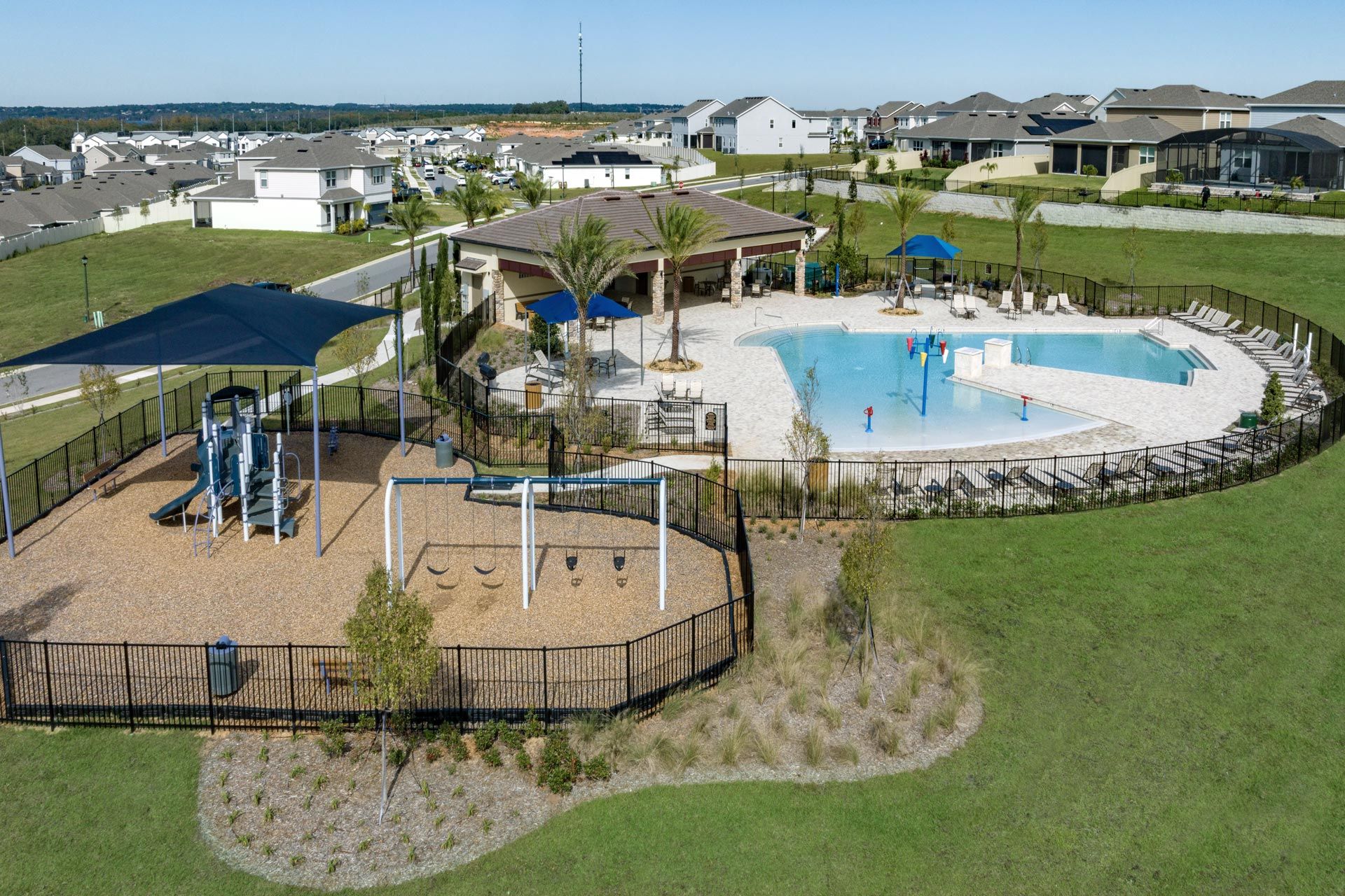 Ridgeview amenities include a resort-style swimming pool with splash pad and cabana, and a shaded playground