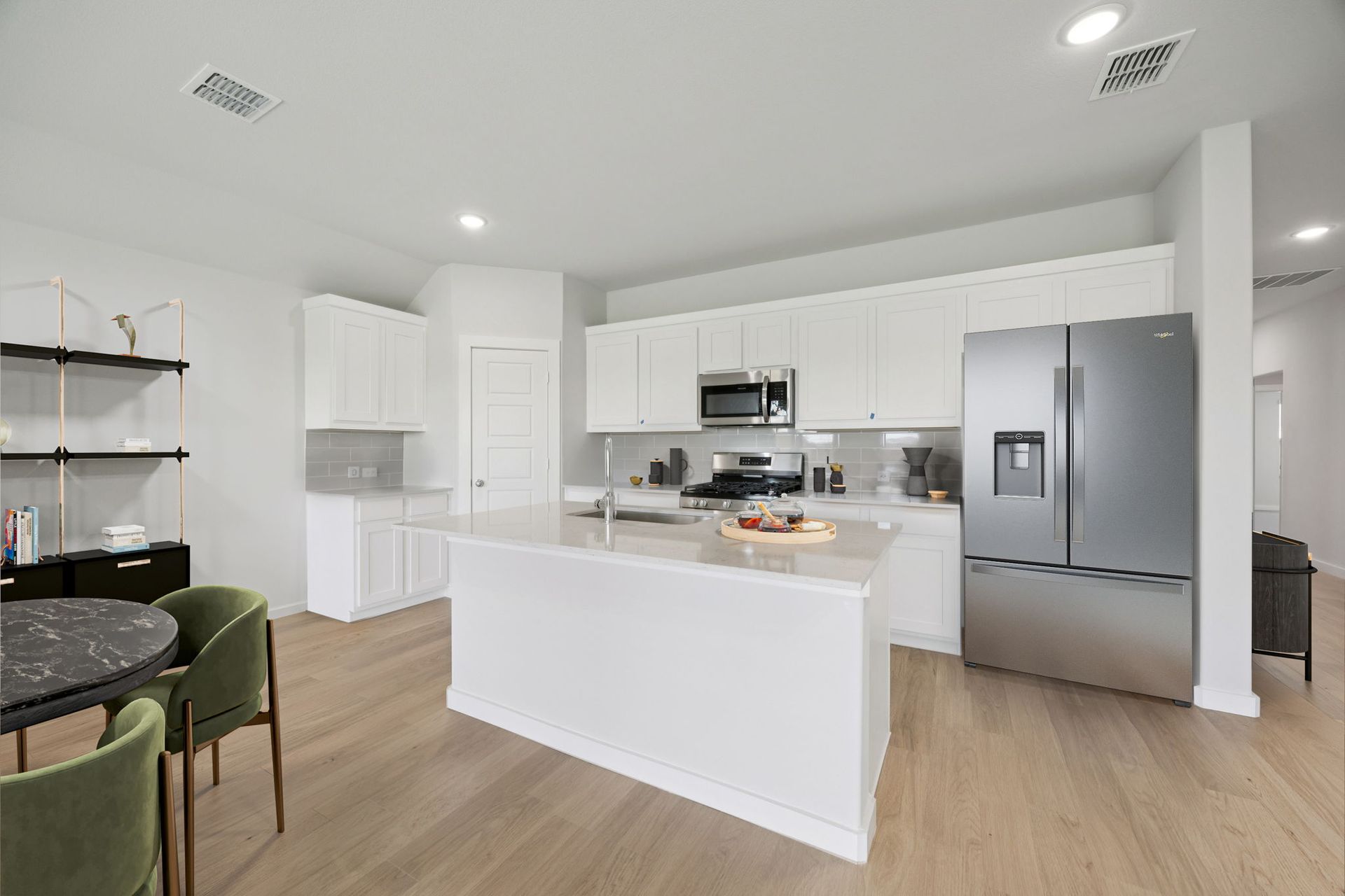 Kitchen in the Hadley home plan by Trophy Signature Homes – REPRESENTATIVE PHOTO