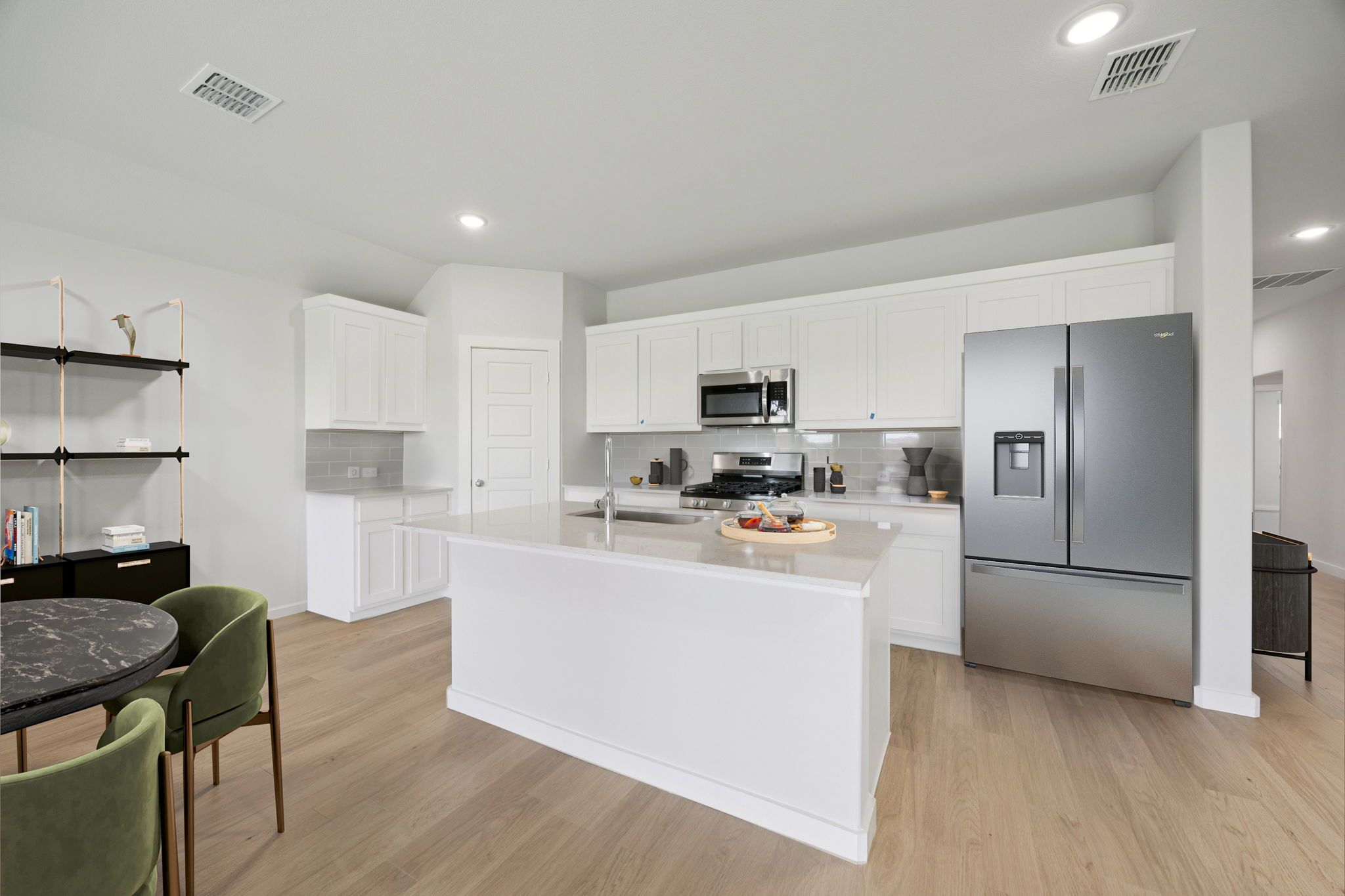 Kitchen in the Hadley home plan by Trophy Signature Homes – REPRESENTATIVE PHOTO