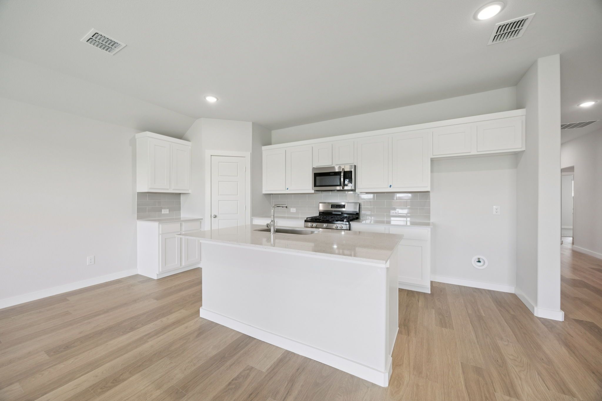 Kitchen in the Hadley home plan by Trophy Signature Homes – REPRESENTATIVE PHOTO