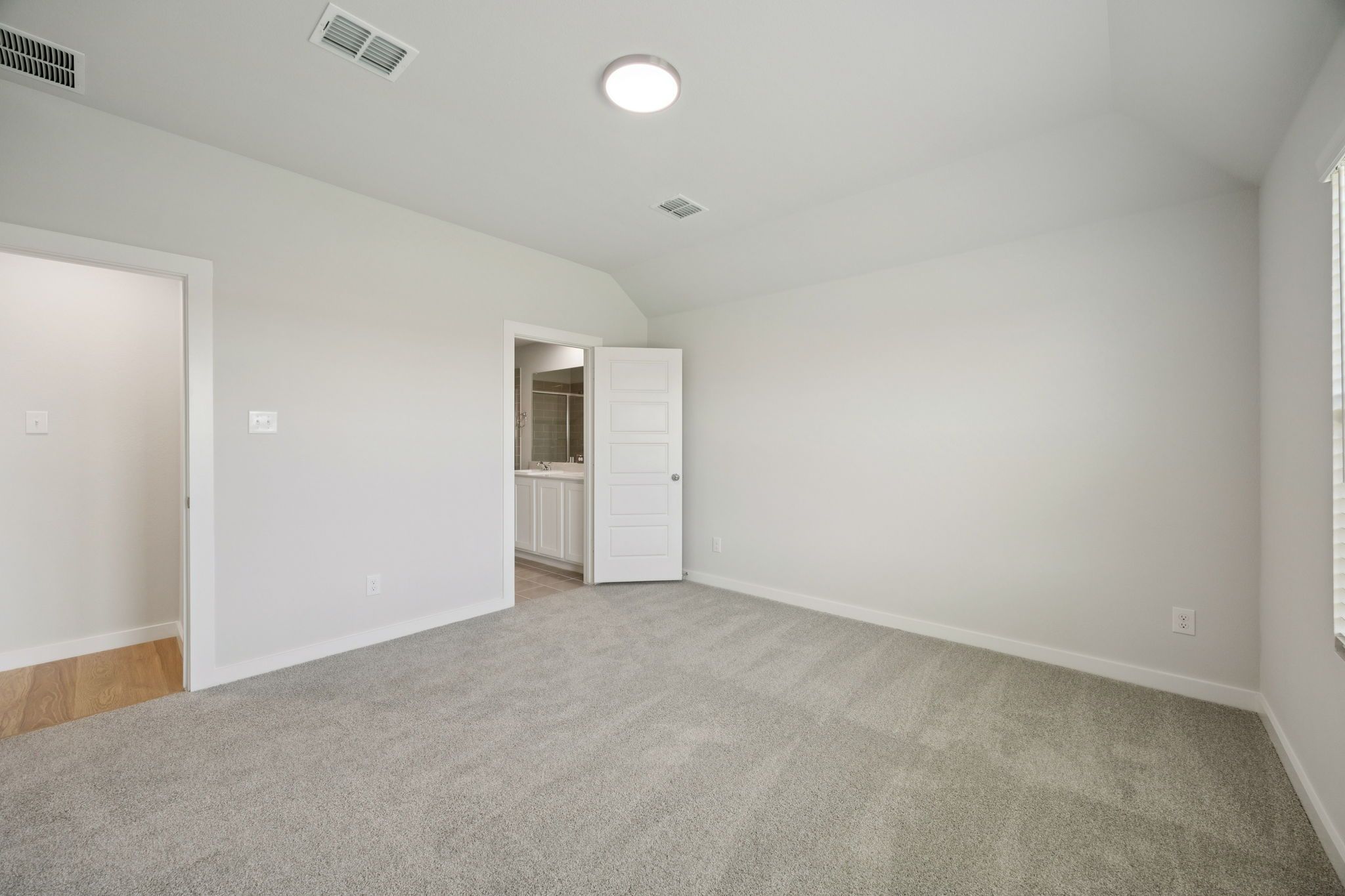 Primary Suite in the Hadley home plan by Trophy Signature Homes – REPRESENTATIVE PHOTO