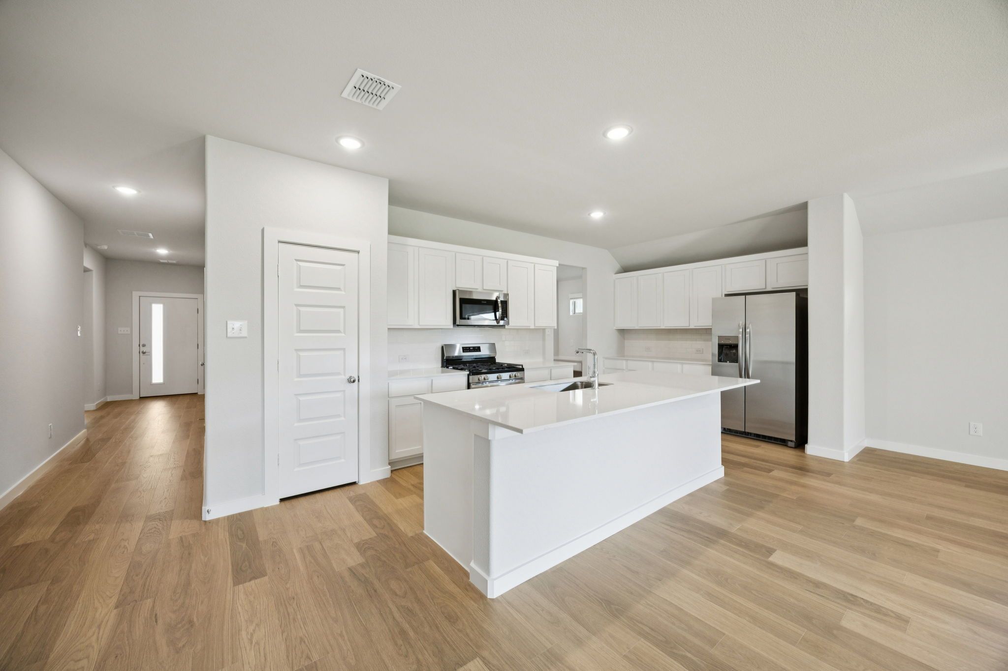 Kitchen in the Heisman home plan by Trophy Signature Homes – REPRESENTATIVE PHOTO