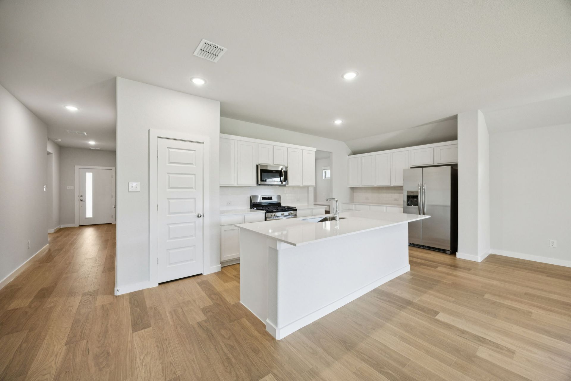 Kitchen in the Heisman home plan by Trophy Signature Homes – REPRESENTATIVE PHOTO