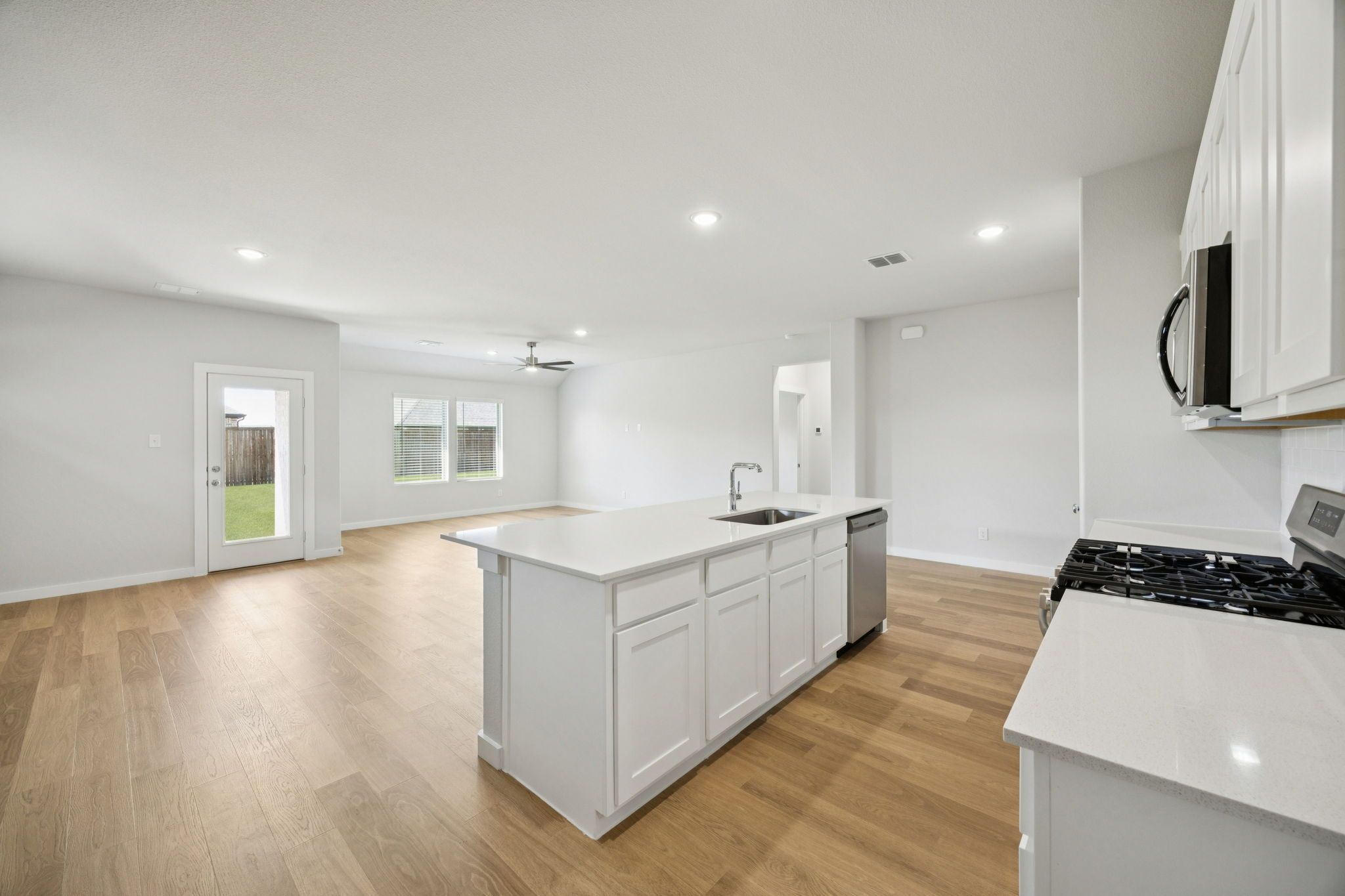 Kitchen in the Heisman home plan by Trophy Signature Homes – REPRESENTATIVE PHOTO