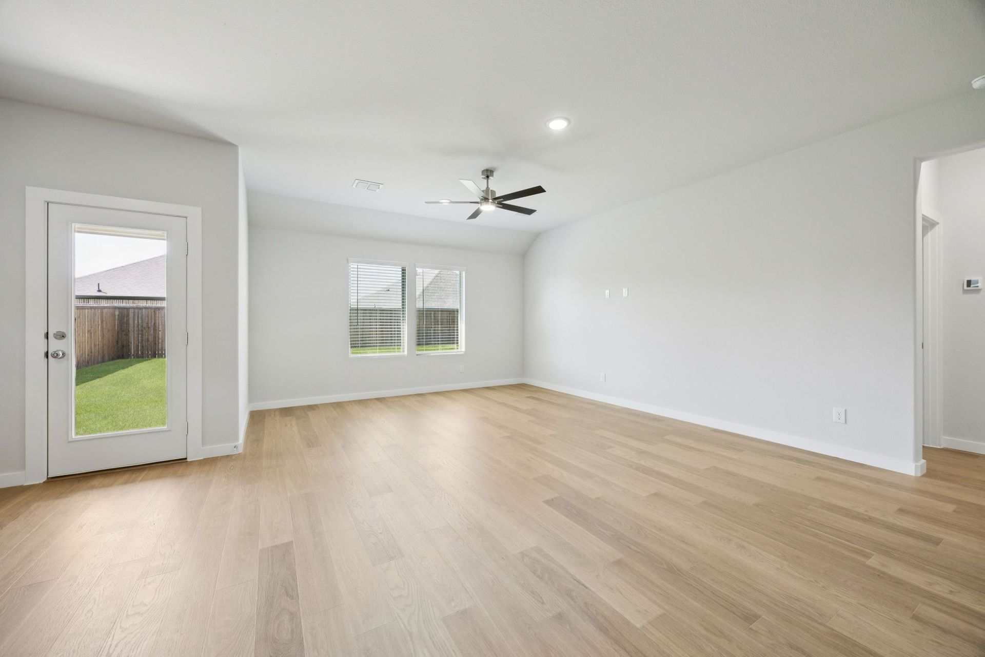 Living Room in the Heisman home plan by Trophy Signature Homes – REPRESENTATIVE PHOTO