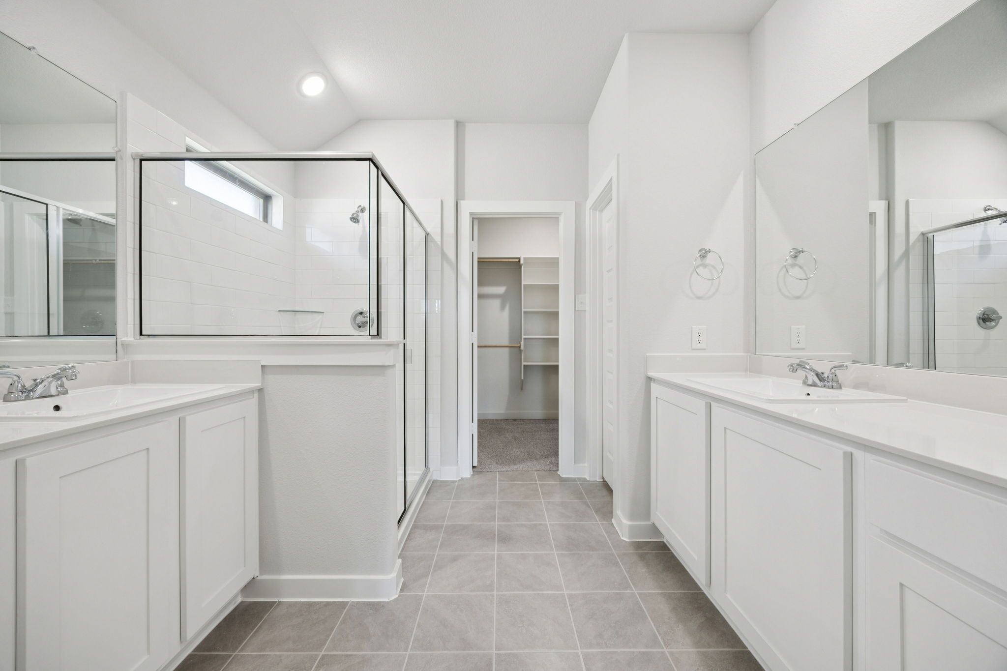 Primary Bathroom in the Heisman home plan by Trophy Signature Homes – REPRESENTATIVE PHOTO