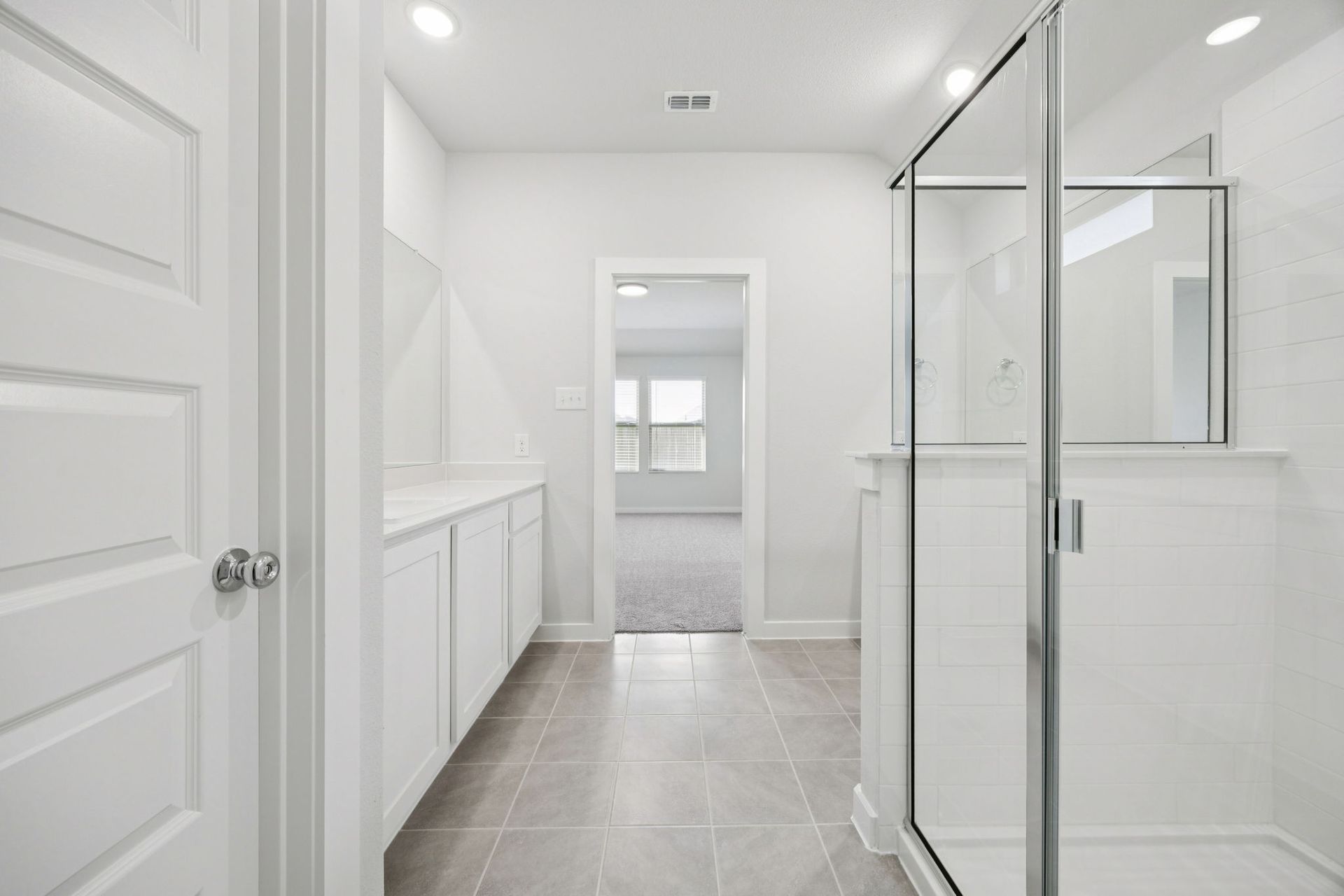 Primary Bathroom in the Heisman home plan by Trophy Signature Homes – REPRESENTATIVE PHOTO