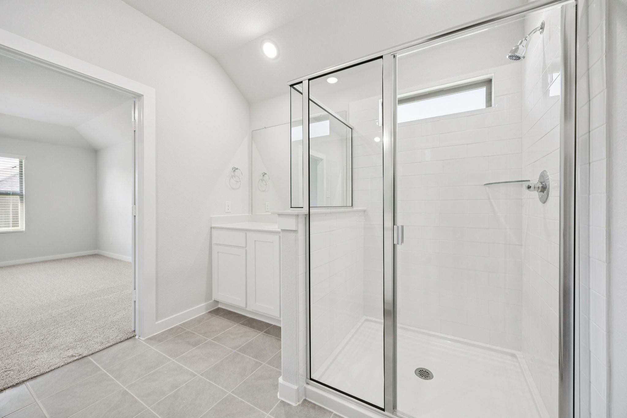 Primary Bathroom in the Heisman home plan by Trophy Signature Homes – REPRESENTATIVE PHOTO