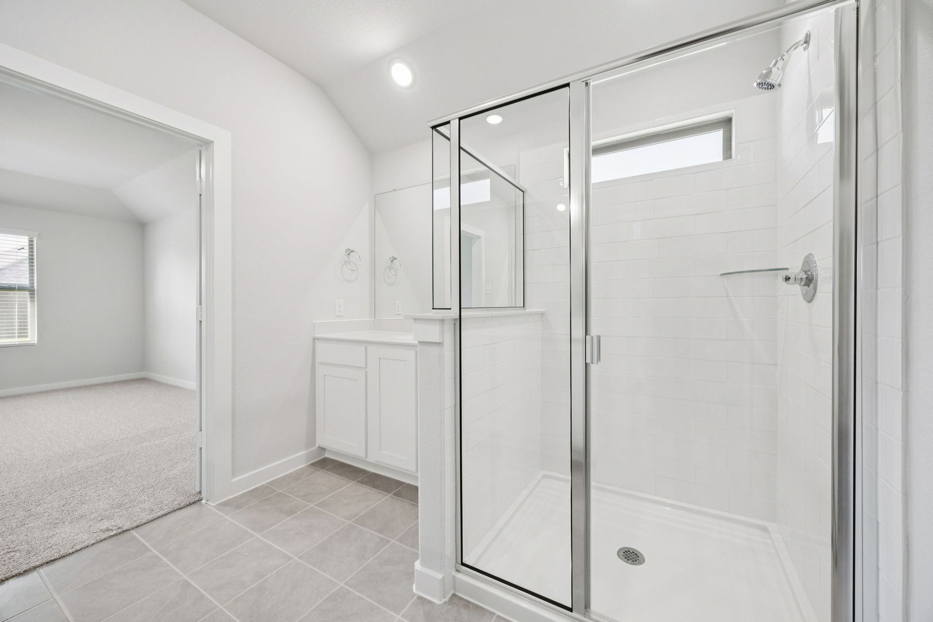 Primary Bathroom in the Heisman home plan by Trophy Signature Homes – REPRESENTATIVE PHOTO