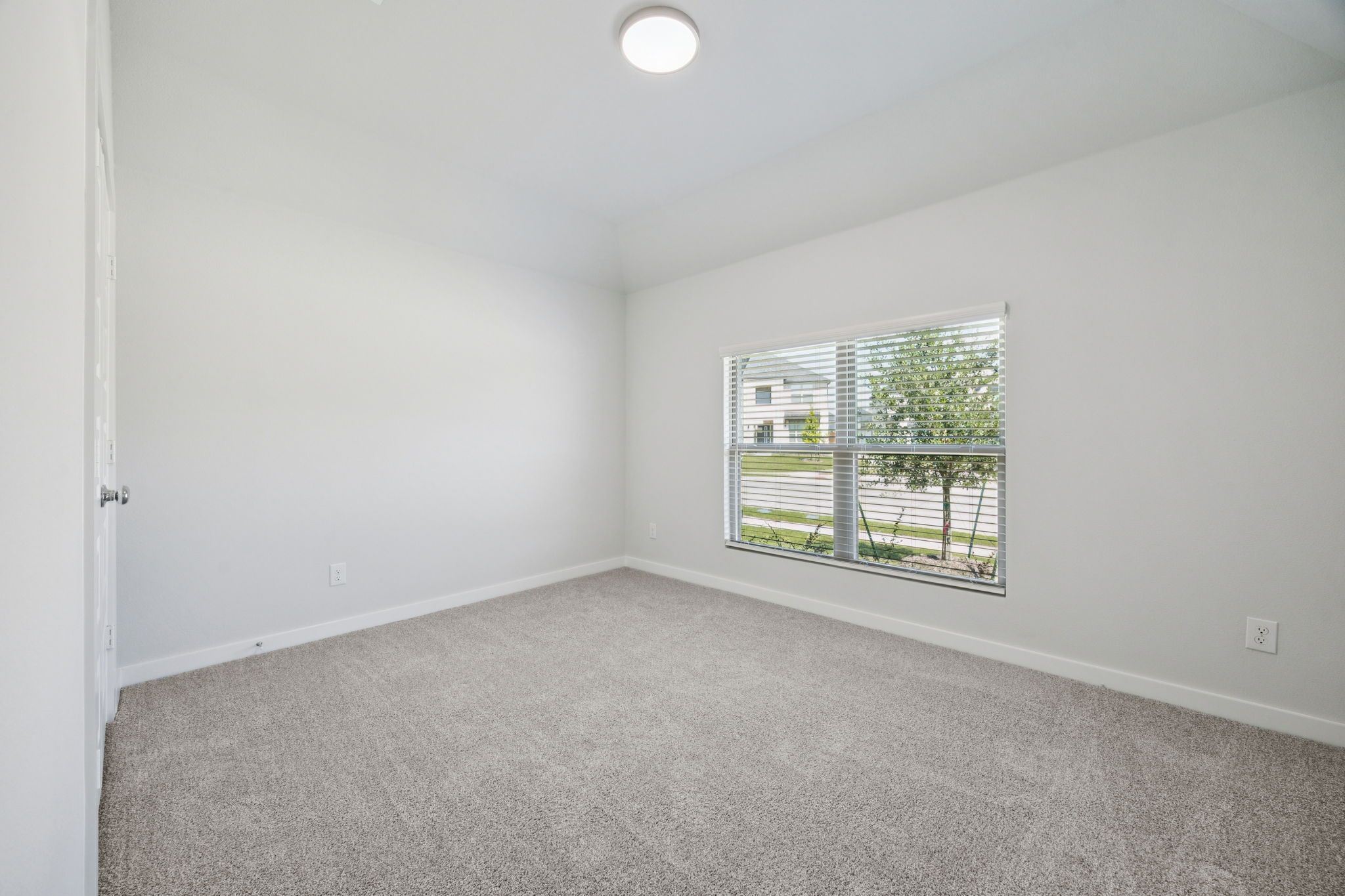 Bedroom in the Heisman home plan by Trophy Signature Homes – REPRESENTATIVE PHOTO