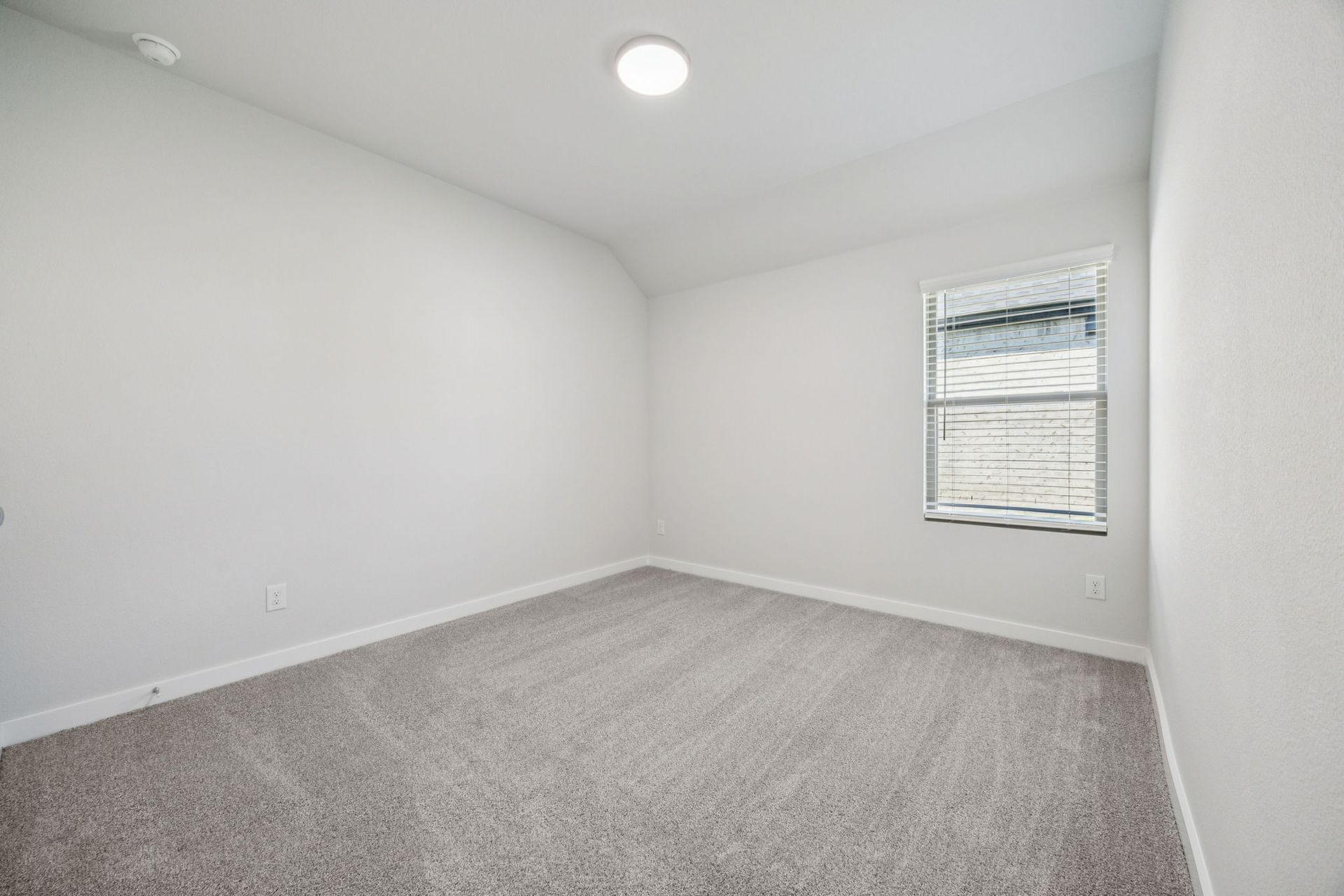 Bedroom in the Heisman home plan by Trophy Signature Homes – REPRESENTATIVE PHOTO