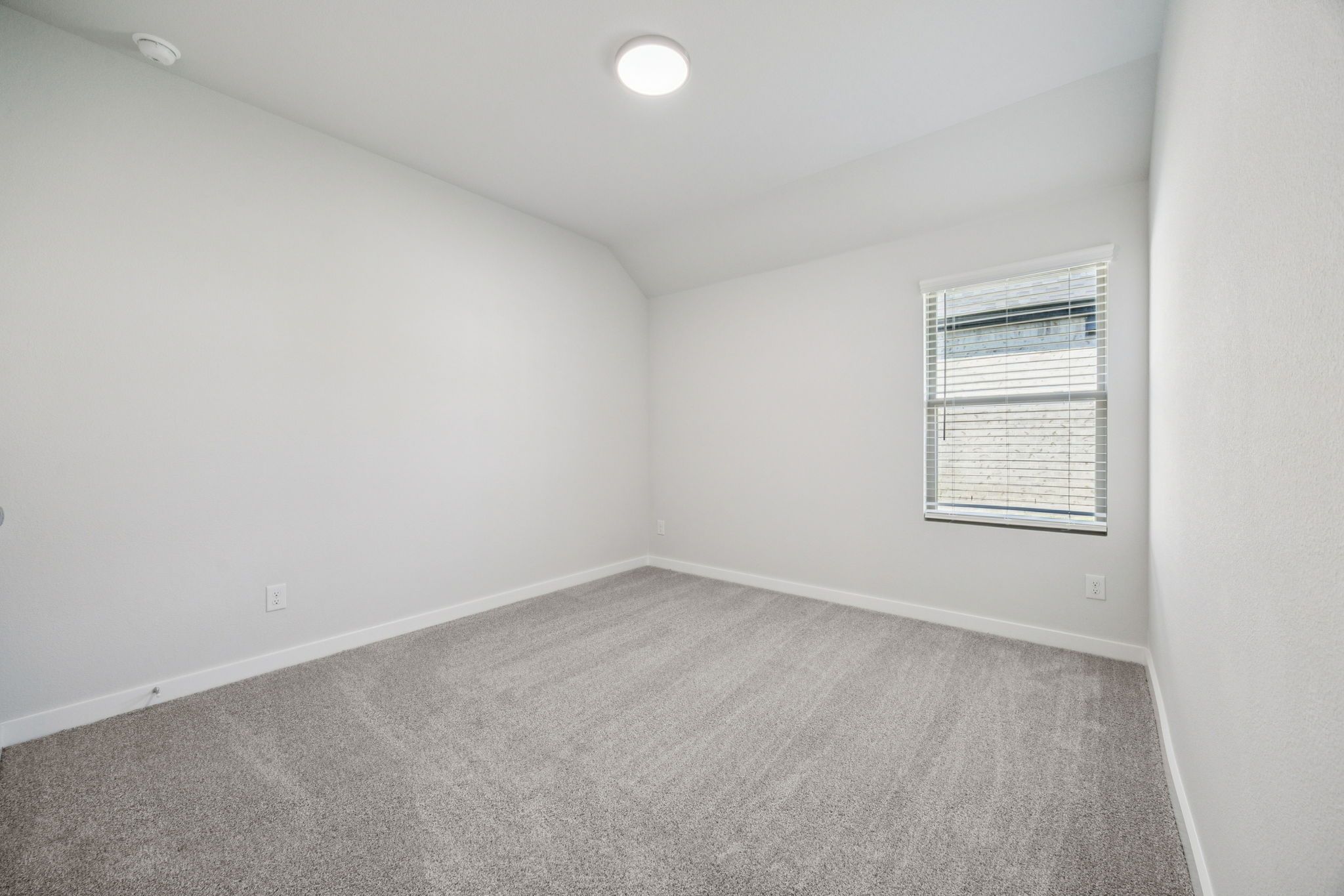 Bedroom in the Heisman home plan by Trophy Signature Homes – REPRESENTATIVE PHOTO