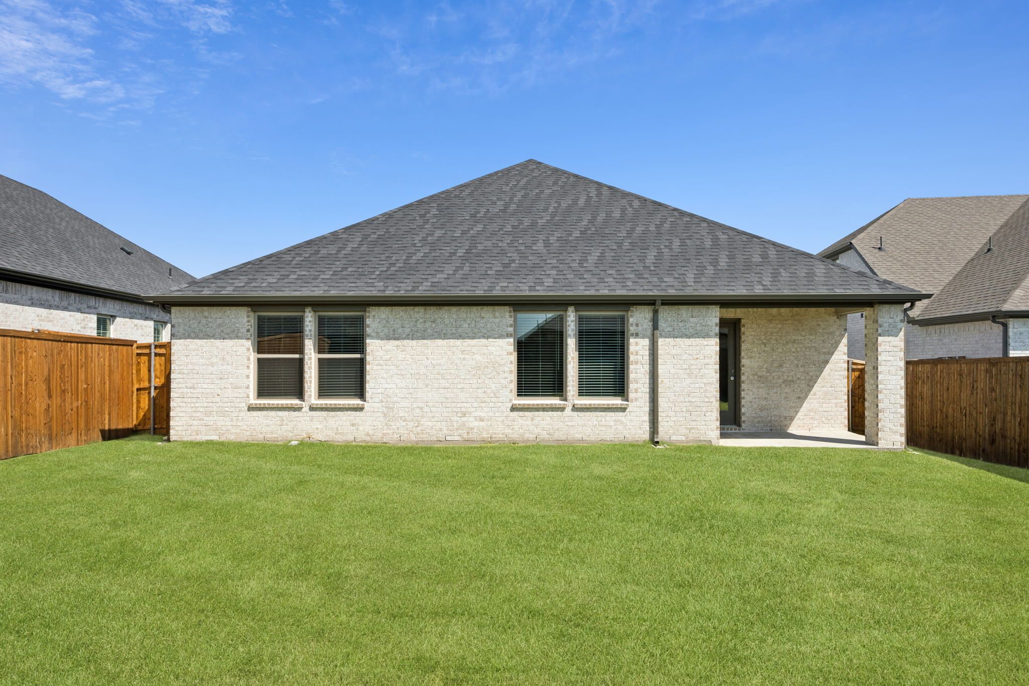 Covered Patio in the Heisman home plan by Trophy Signature Homes – REPRESENTATIVE PHOTO