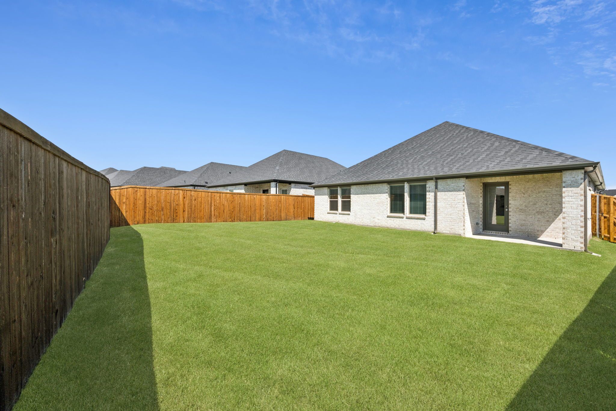 Covered Patio in the Heisman home plan by Trophy Signature Homes – REPRESENTATIVE PHOTO
