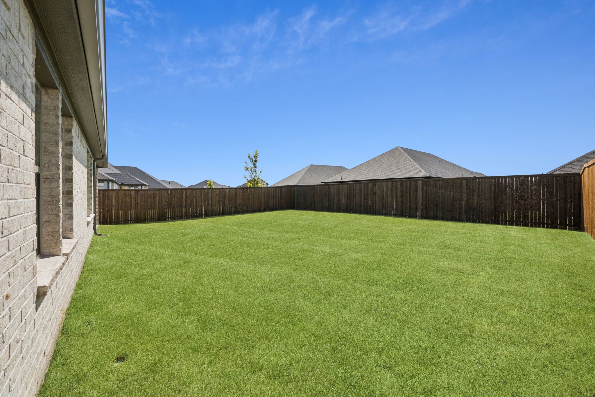 Yard in the Heisman home plan by Trophy Signature Homes – REPRESENTATIVE PHOTO