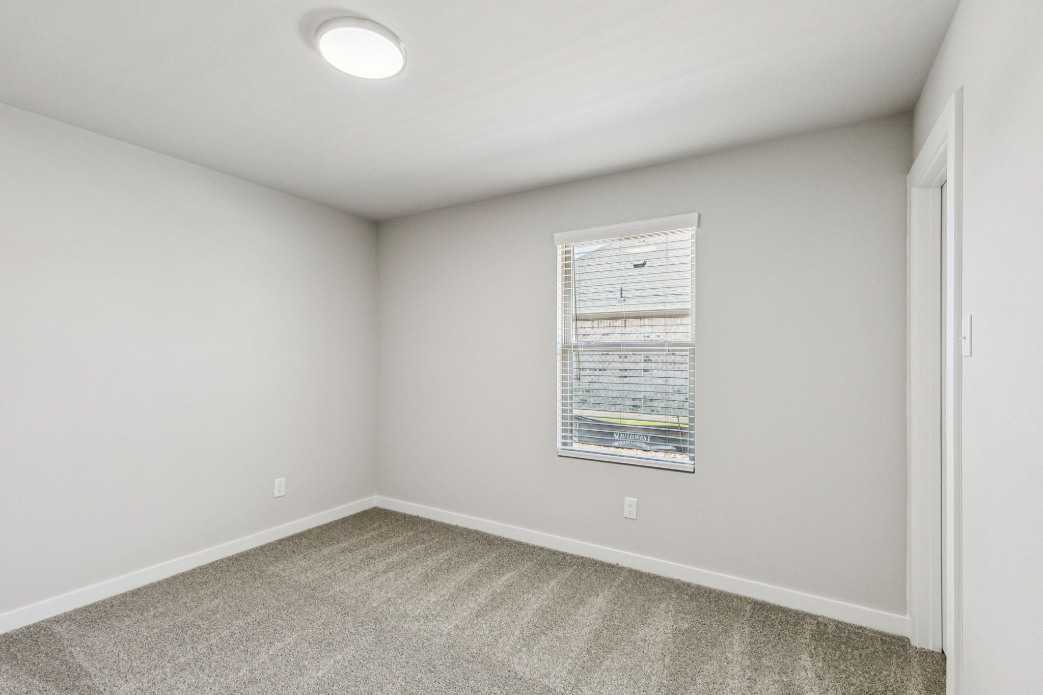 Bedroom in the Harper home plan by Trophy Signature Homes – REPRESENTATIVE PHOTO
