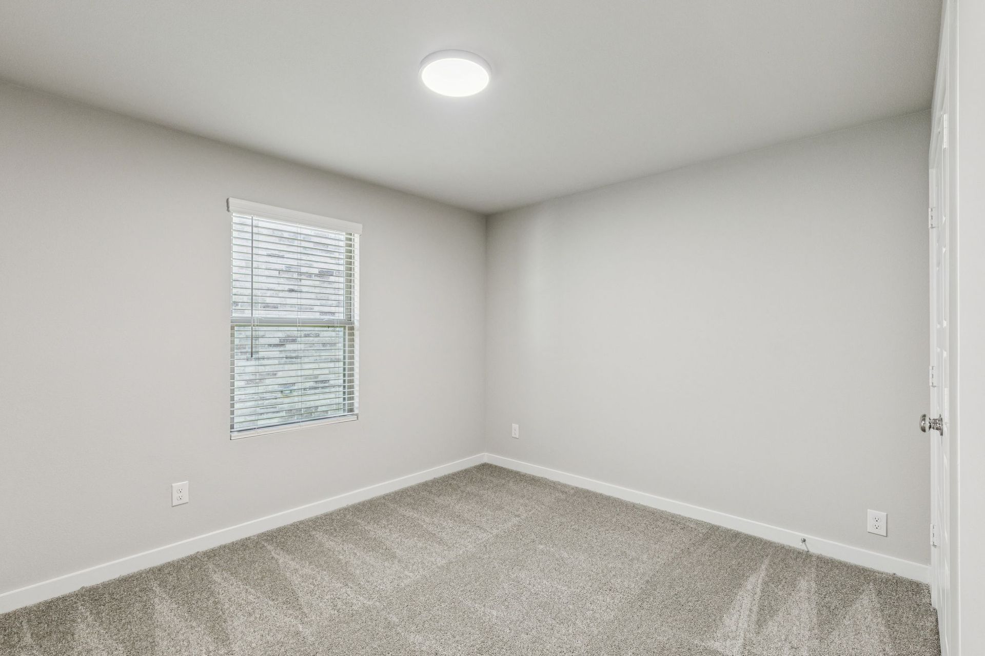 Bedroom in the Harper home plan by Trophy Signature Homes – REPRESENTATIVE PHOTO
