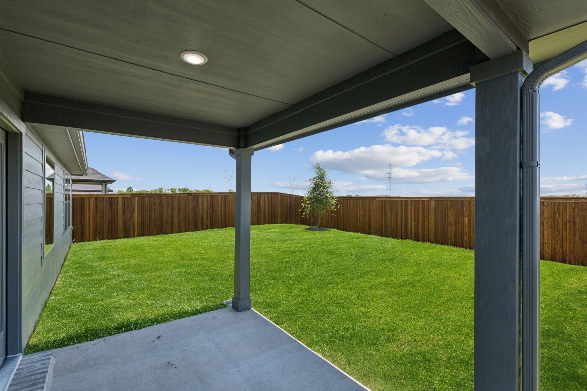 Patio in the Harper home plan by Trophy Signature Homes – REPRESENTATIVE PHOTO