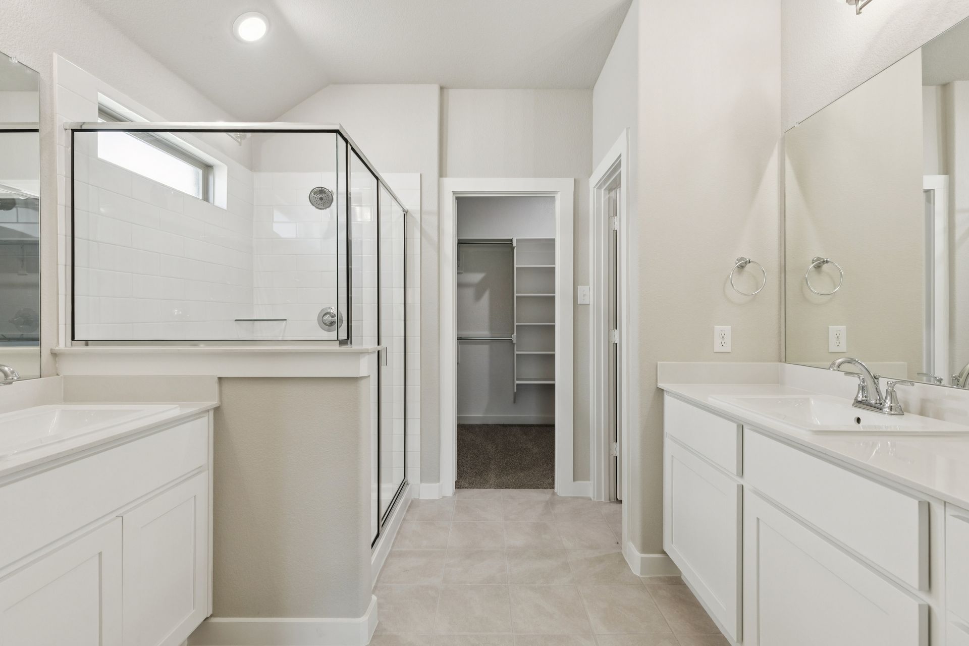 Primary Bathroom in the Heisman home plan by Trophy Signature Homes – REPRESENTATIVE PHOTO