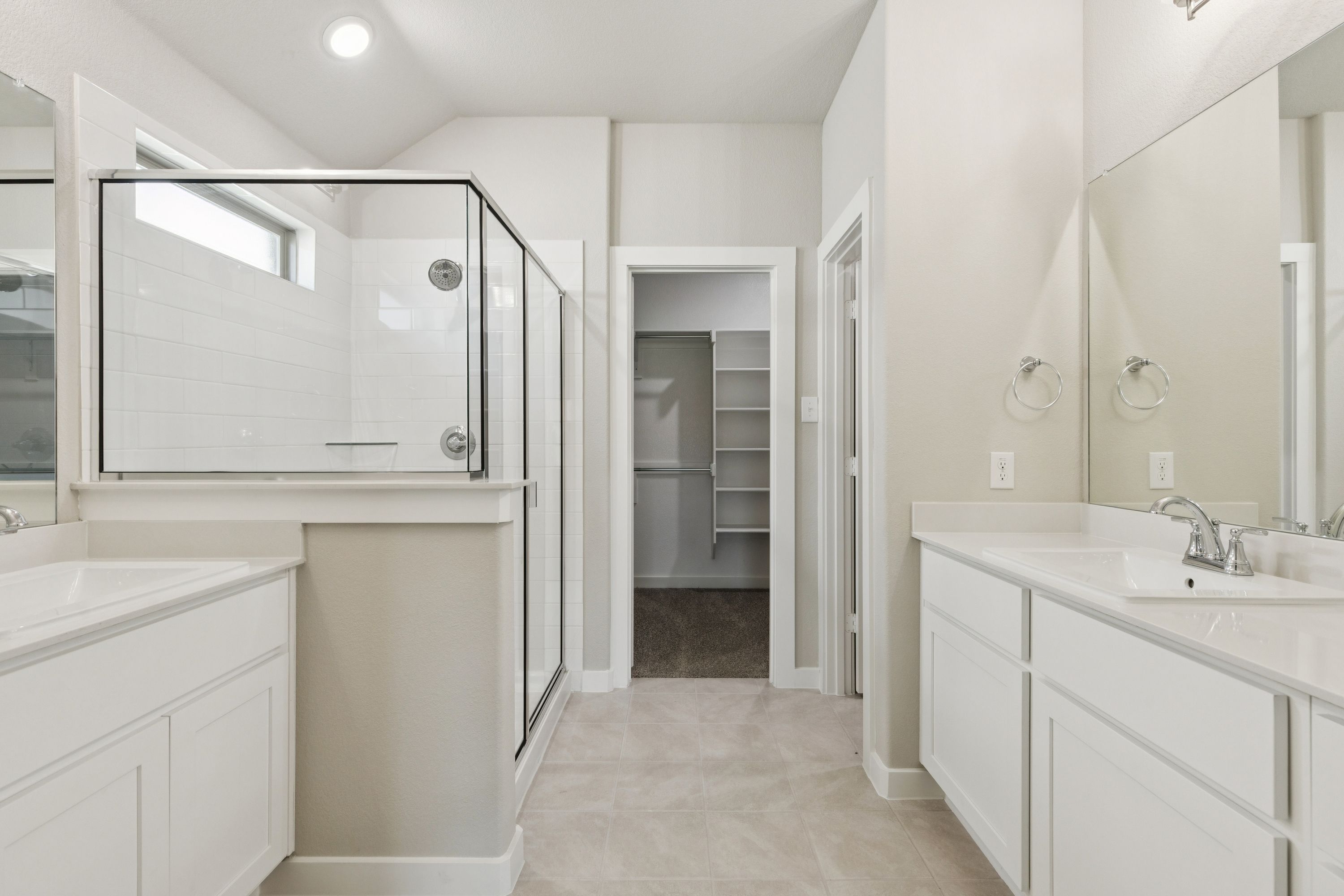 Primary Bathroom in the Heisman home plan by Trophy Signature Homes – REPRESENTATIVE PHOTO