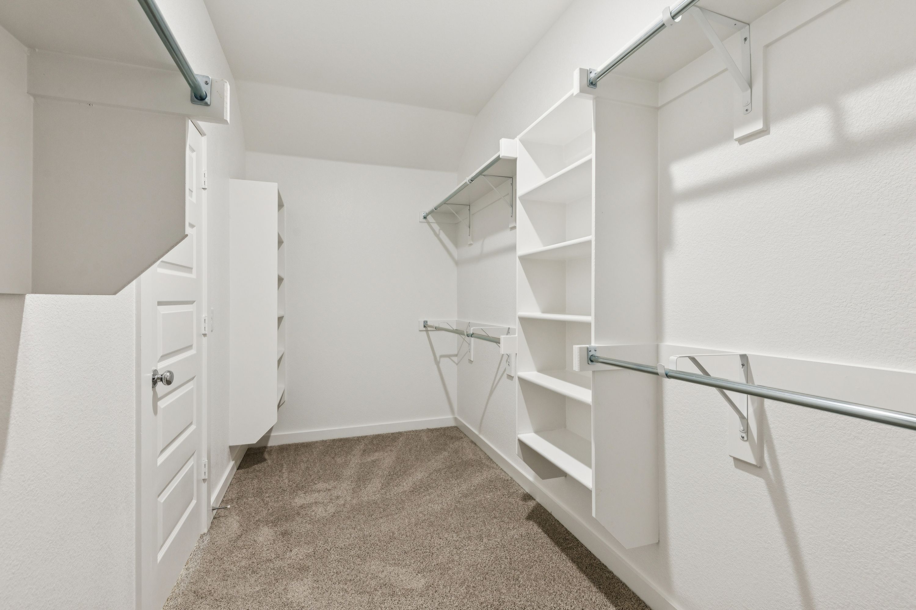 Primary Closet in the Heisman home plan by Trophy Signature Homes – REPRESENTATIVE PHOTO