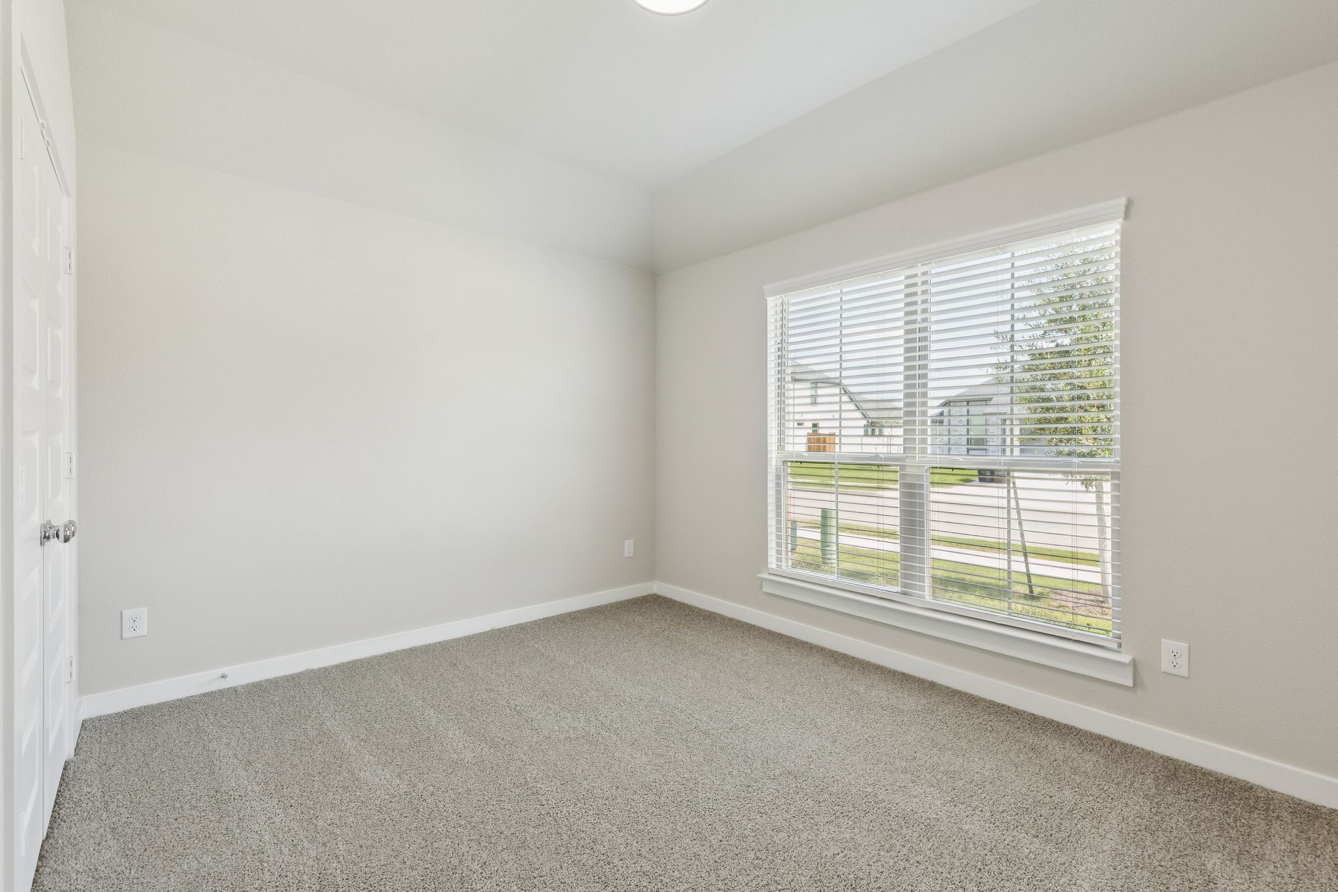 Bedroom in the Heisman home plan by Trophy Signature Homes – REPRESENTATIVE PHOTO