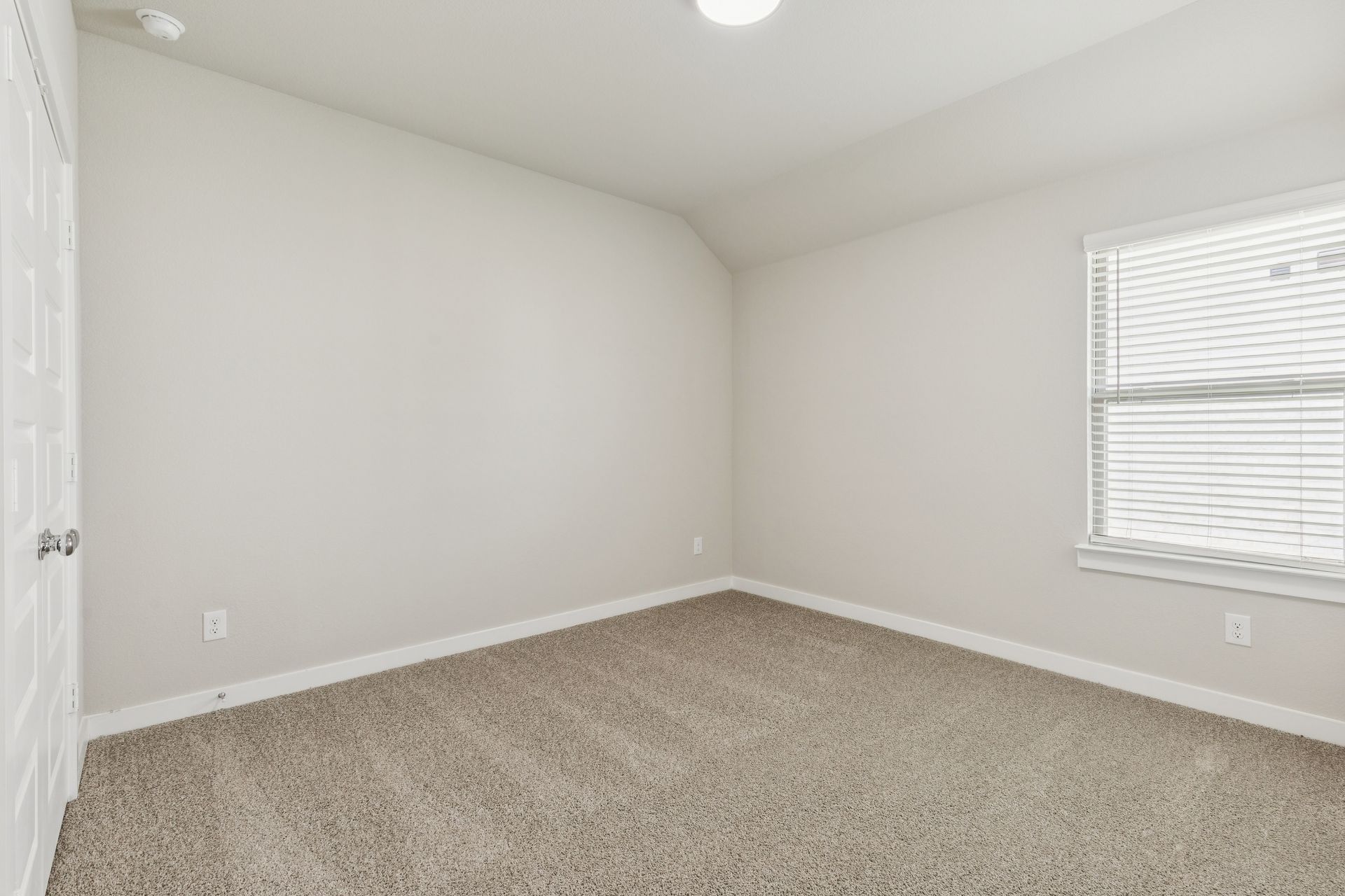 Bedroom in the Heisman home plan by Trophy Signature Homes – REPRESENTATIVE PHOTO