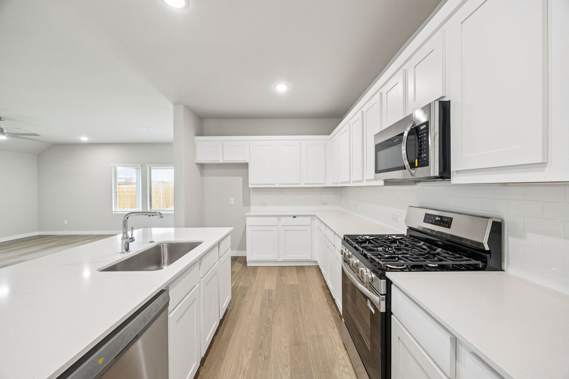 Kitchen in the Hayden home plan by Trophy Signature Homes – REPRESENTATIVE PHOTO