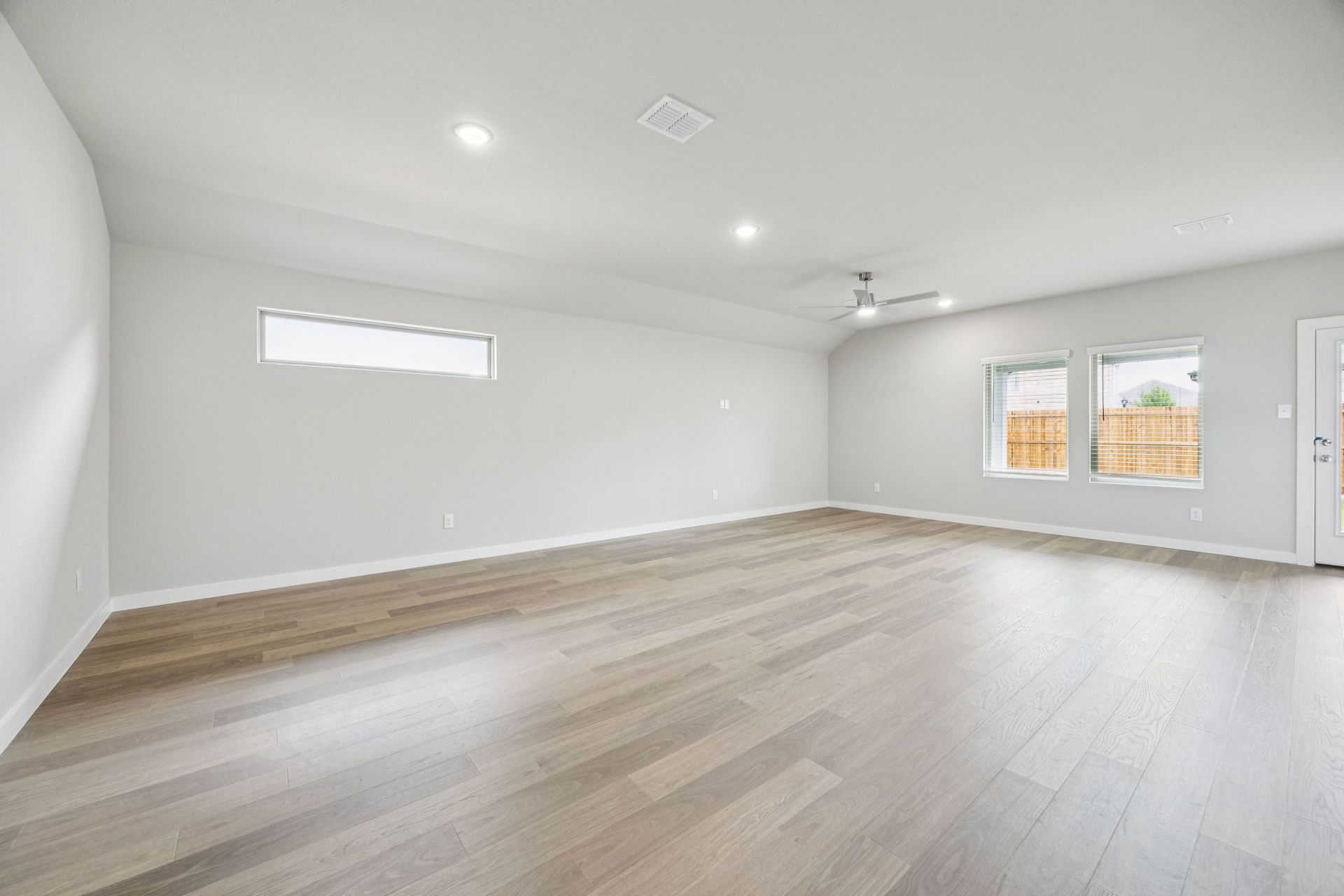 Dining and Living Room in the Hayden home plan by Trophy Signature Homes – REPRESENTATIVE PHOTO