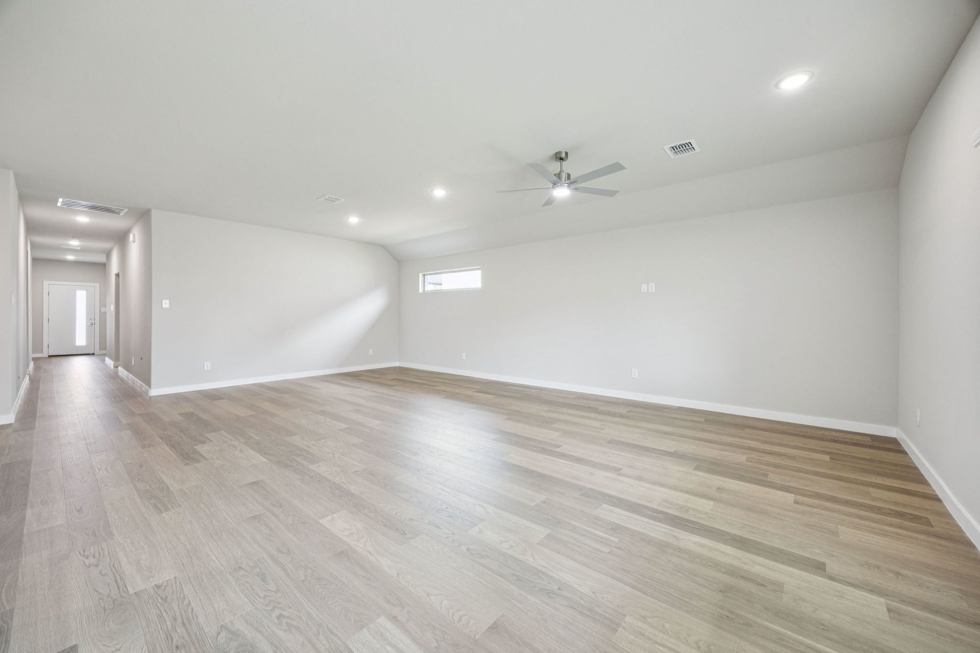 Dining and Living Room in the Hayden home plan by Trophy Signature Homes – REPRESENTATIVE PHOTO
