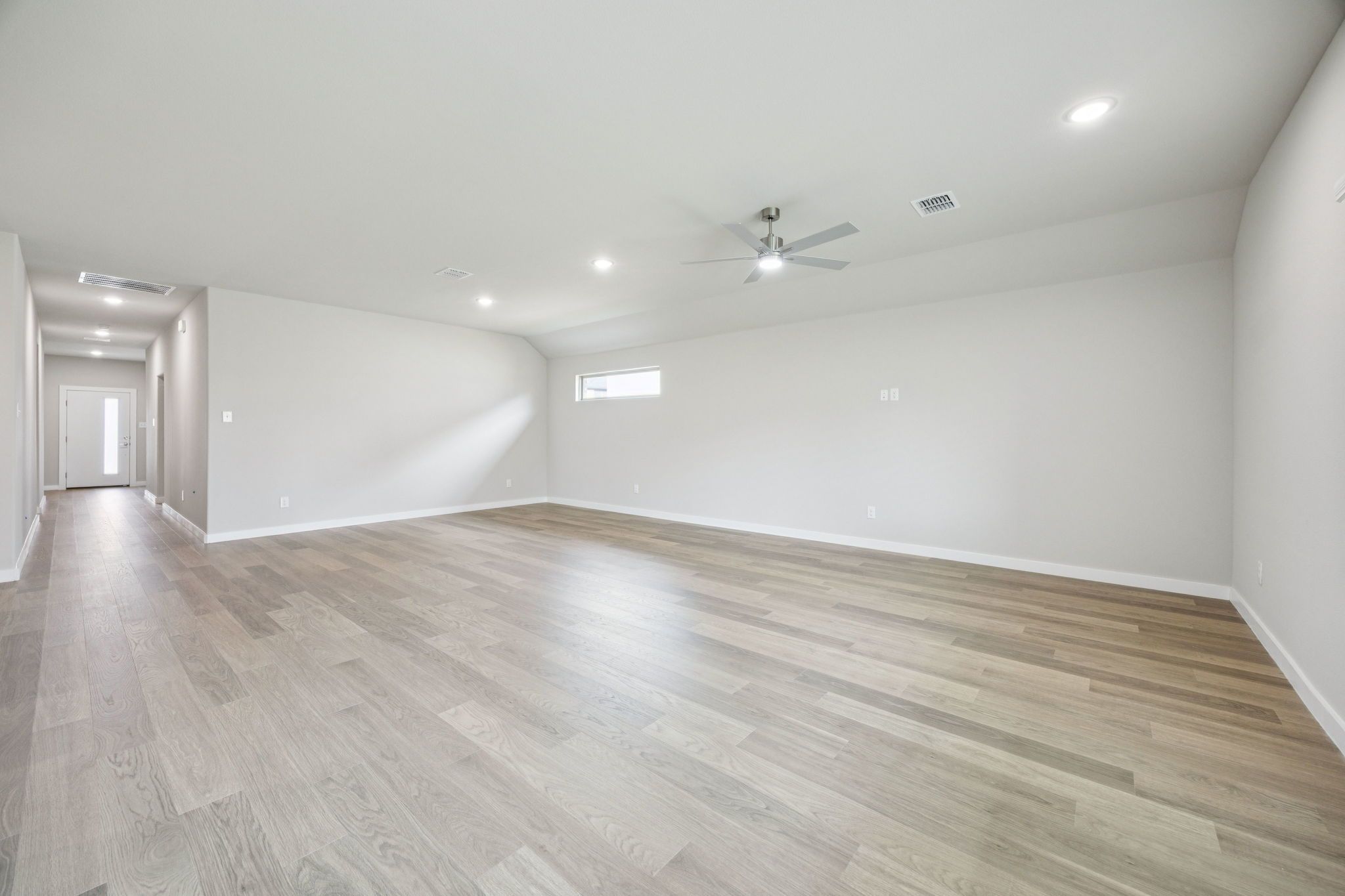 Dining and Living Room in the Hayden home plan by Trophy Signature Homes – REPRESENTATIVE PHOTO