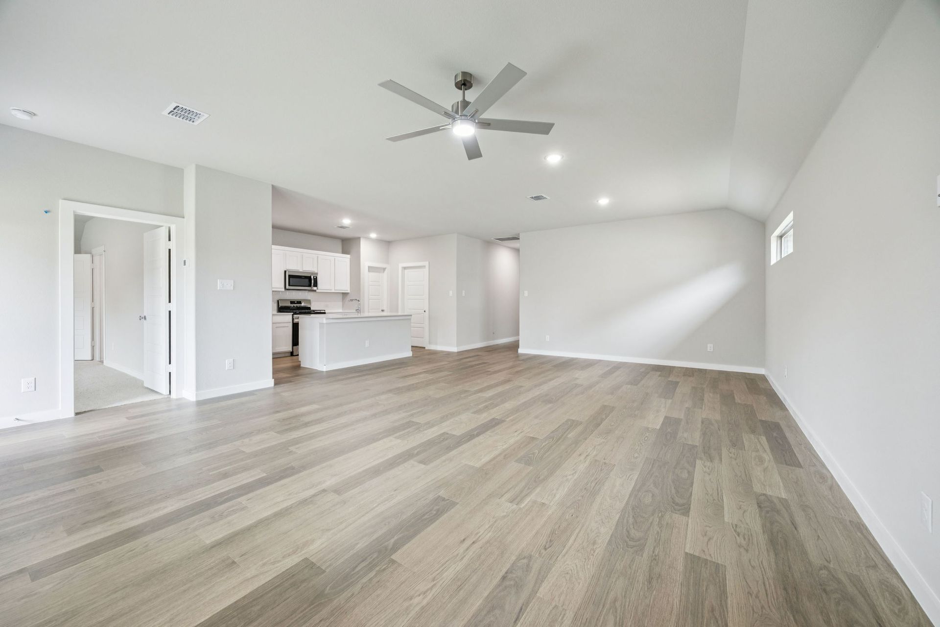 Dining and Living Room in the Hayden home plan by Trophy Signature Homes – REPRESENTATIVE PHOTO