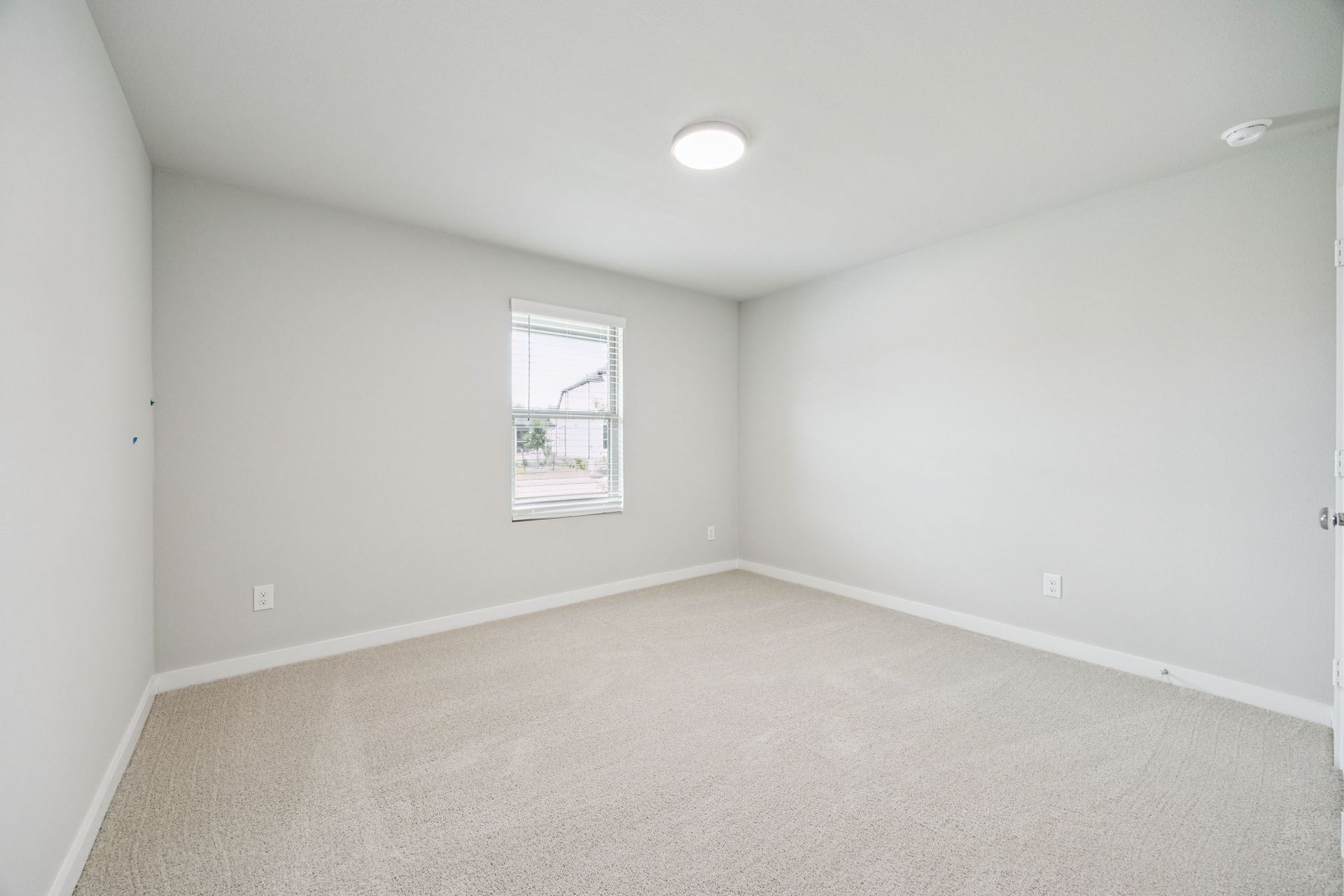 Bedroom in the Hayden home plan by Trophy Signature Homes – REPRESENTATIVE PHOTO