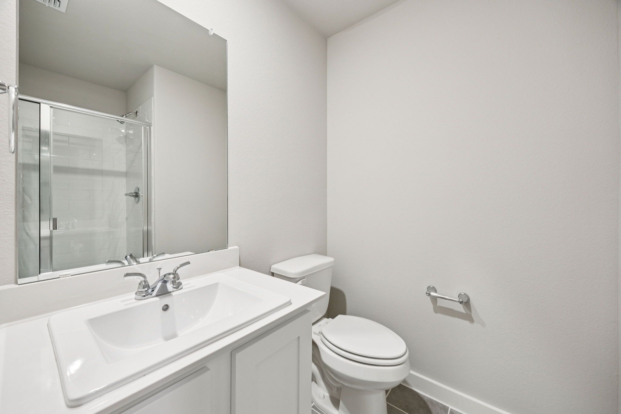 Bathroom in the Hayden home plan by Trophy Signature Homes – REPRESENTATIVE PHOTO