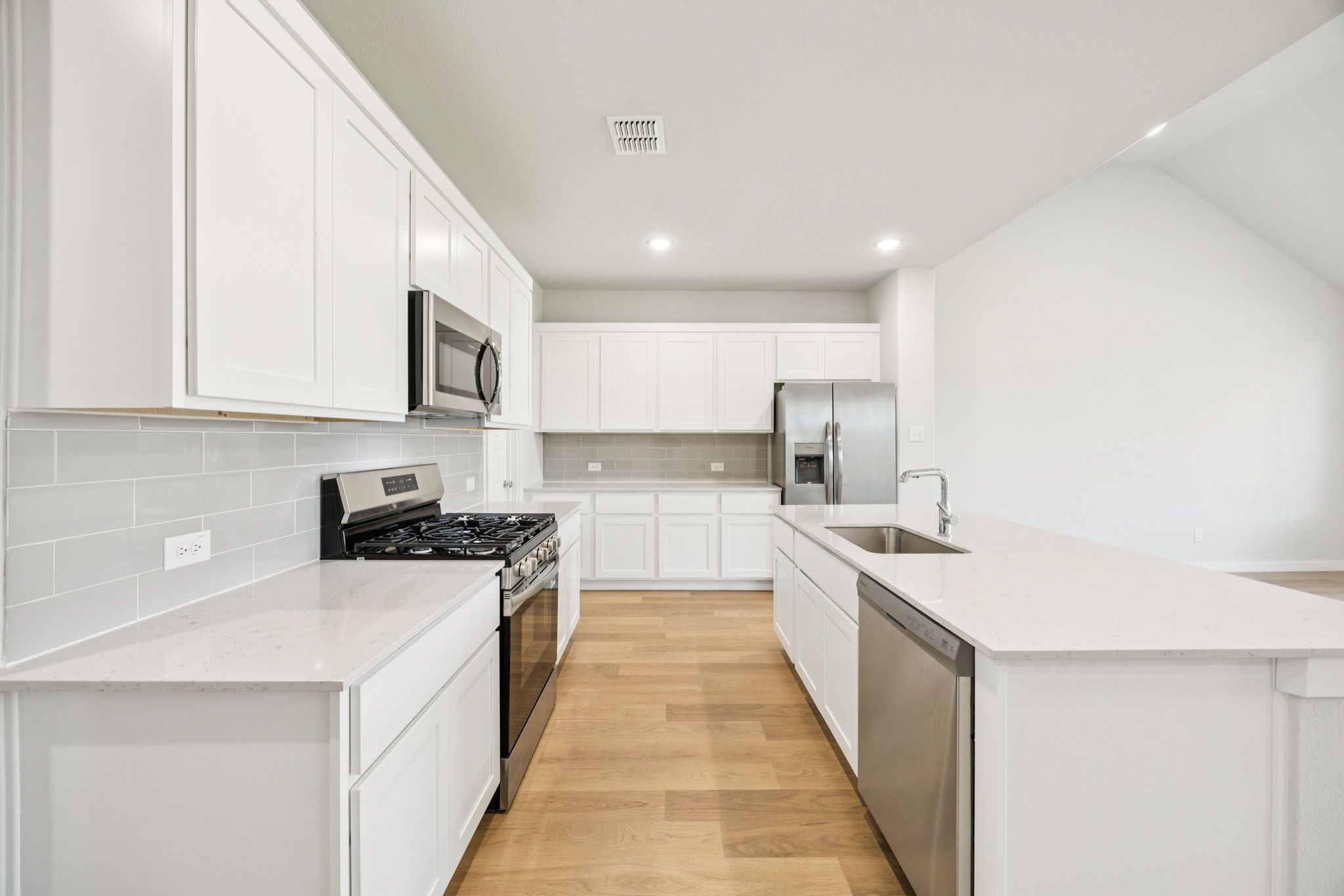 Kitchen in the Masters home plan by Trophy Signature Homes – REPRESENTATIVE PHOTO