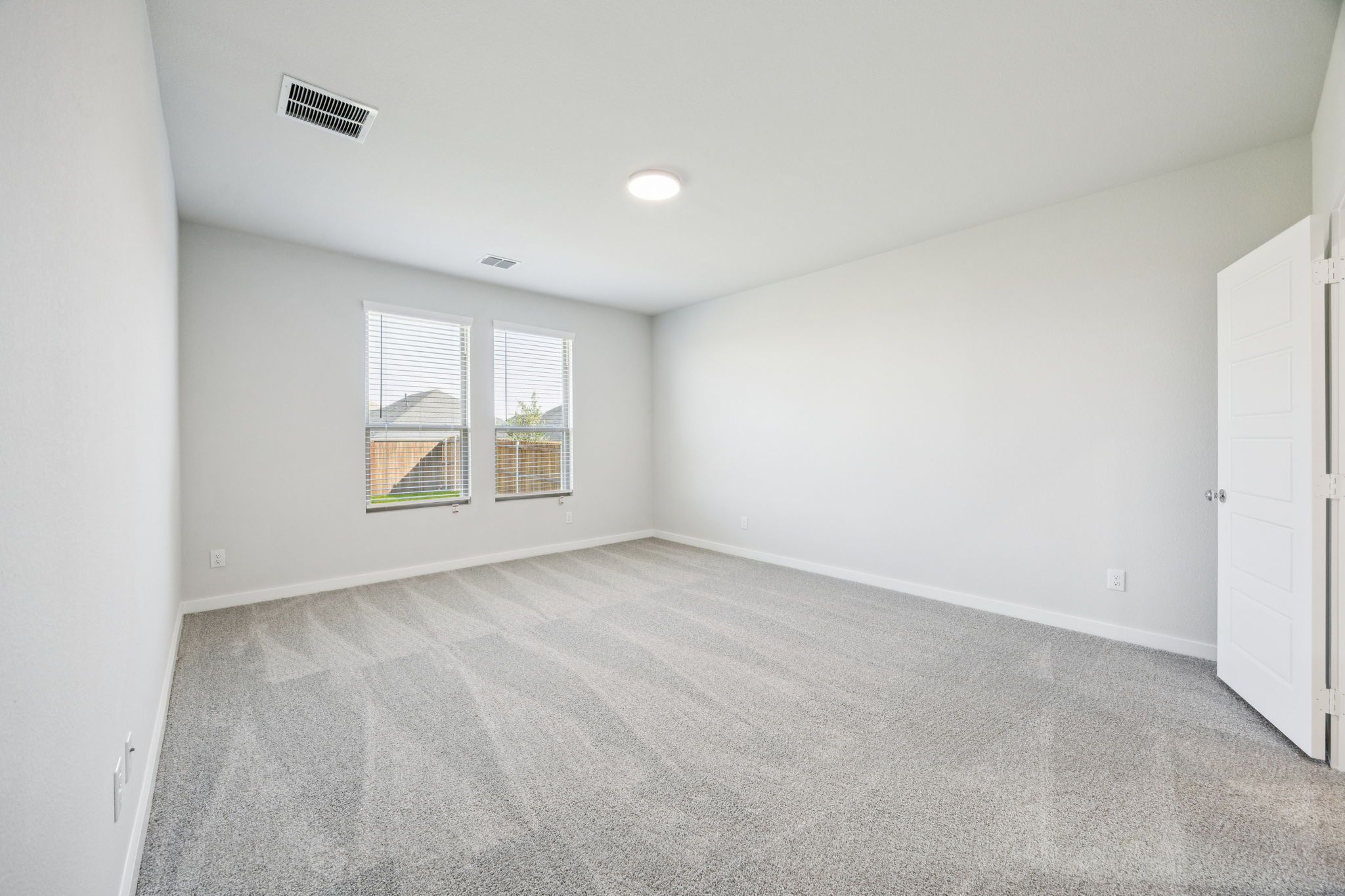 Primary Suite in the Masters home plan by Trophy Signature Homes – REPRESENTATIVE PHOTO