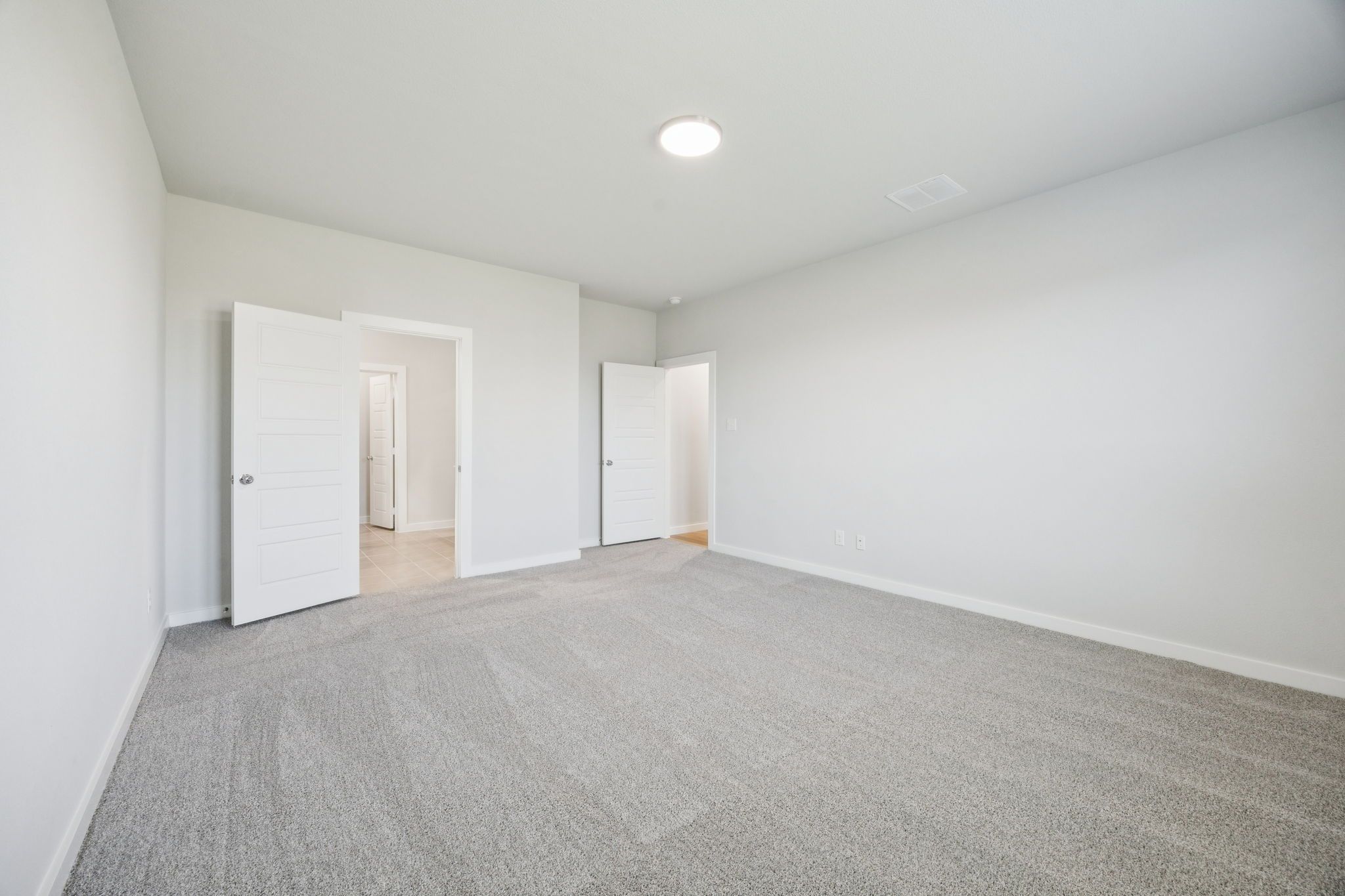 Primary Suite in the Masters home plan by Trophy Signature Homes – REPRESENTATIVE PHOTO