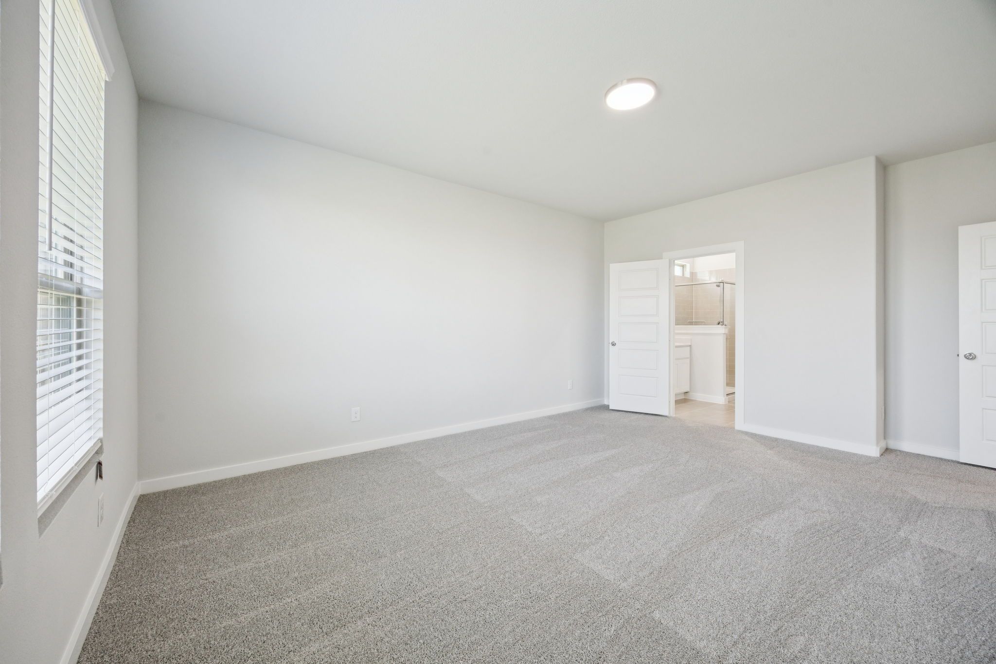 Primary Suite in the Masters home plan by Trophy Signature Homes – REPRESENTATIVE PHOTO