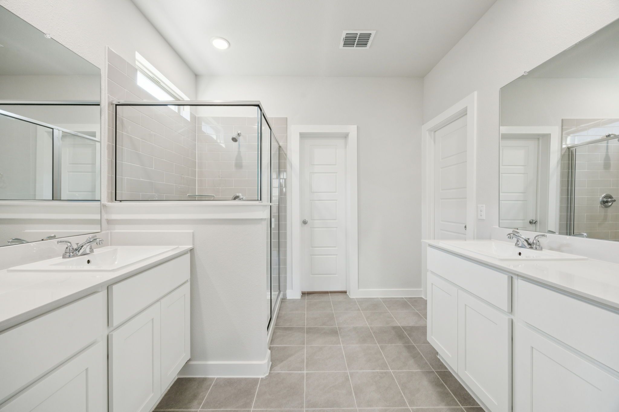 Primary Bathroom in the Masters home plan by Trophy Signature Homes – REPRESENTATIVE PHOTO