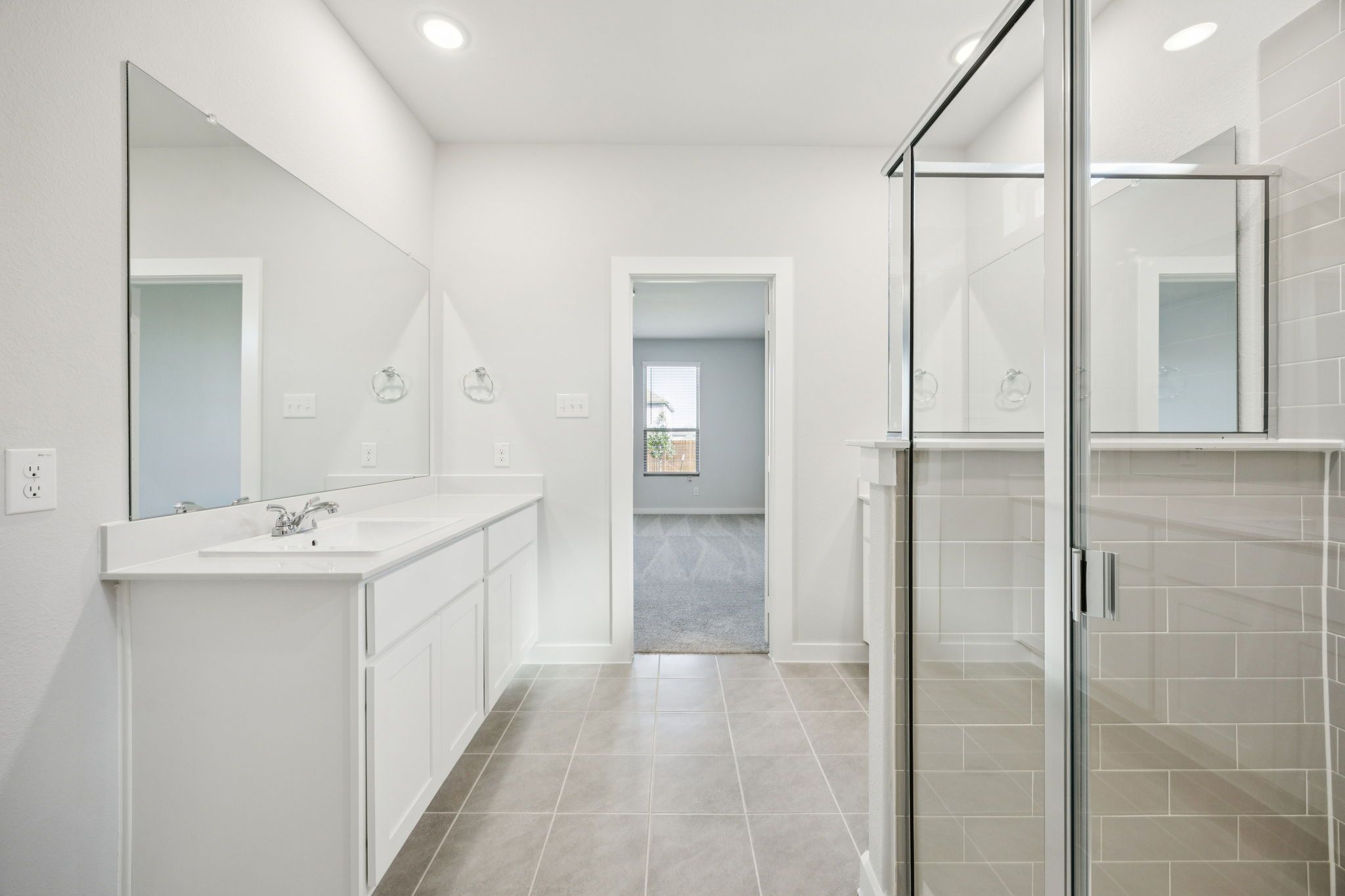 Primary Bathroom in the Masters home plan by Trophy Signature Homes – REPRESENTATIVE PHOTO
