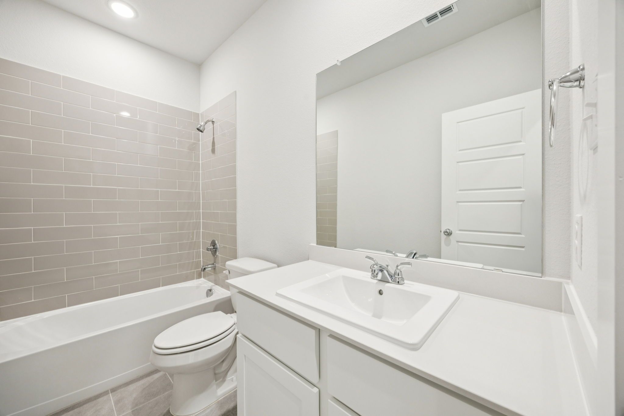 Bathroom in the Masters home plan by Trophy Signature Homes – REPRESENTATIVE PHOTO