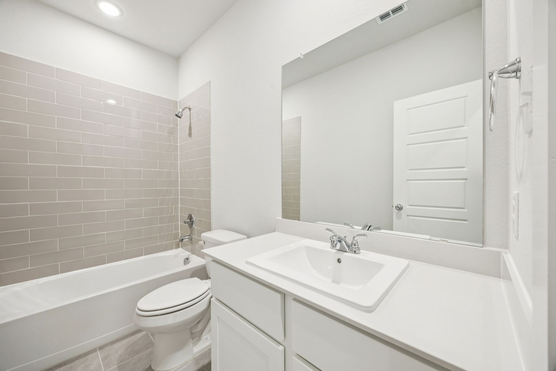 Bathroom in the Masters home plan by Trophy Signature Homes – REPRESENTATIVE PHOTO