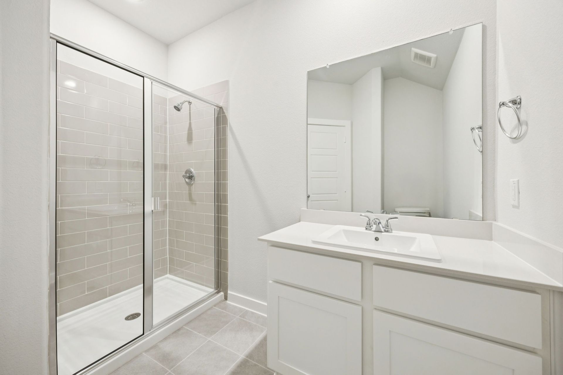 Bathroom in the Masters home plan by Trophy Signature Homes – REPRESENTATIVE PHOTO
