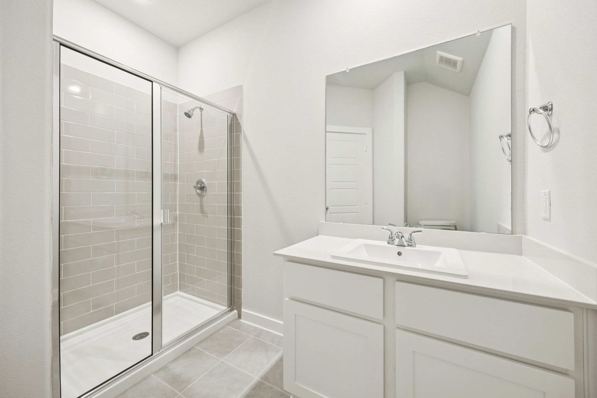 Bathroom in the Masters home plan by Trophy Signature Homes – REPRESENTATIVE PHOTO