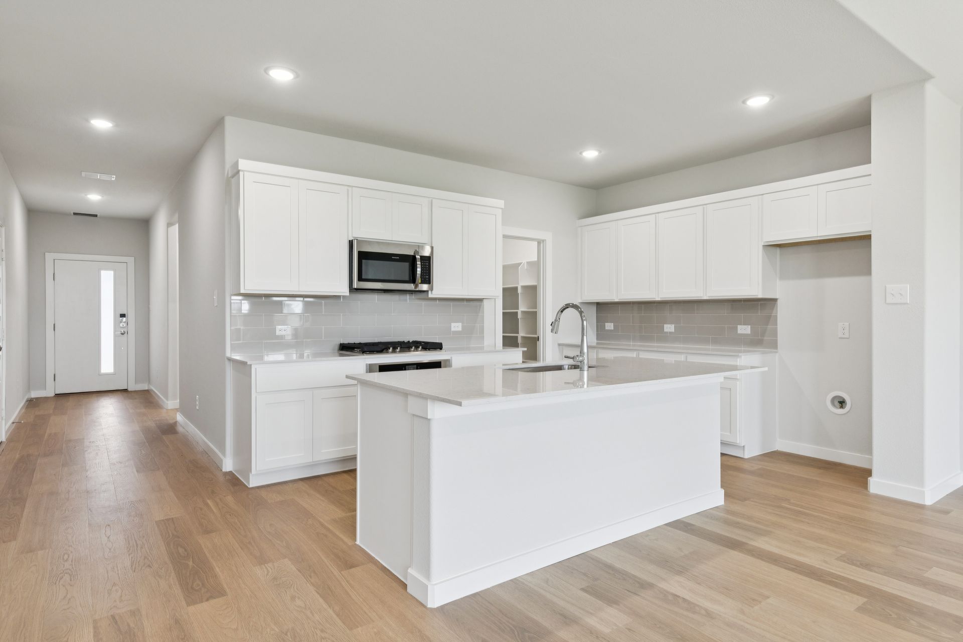 Kitchen in the Masters home plan by Trophy Signature Homes – REPRESENTATIVE PHOTO