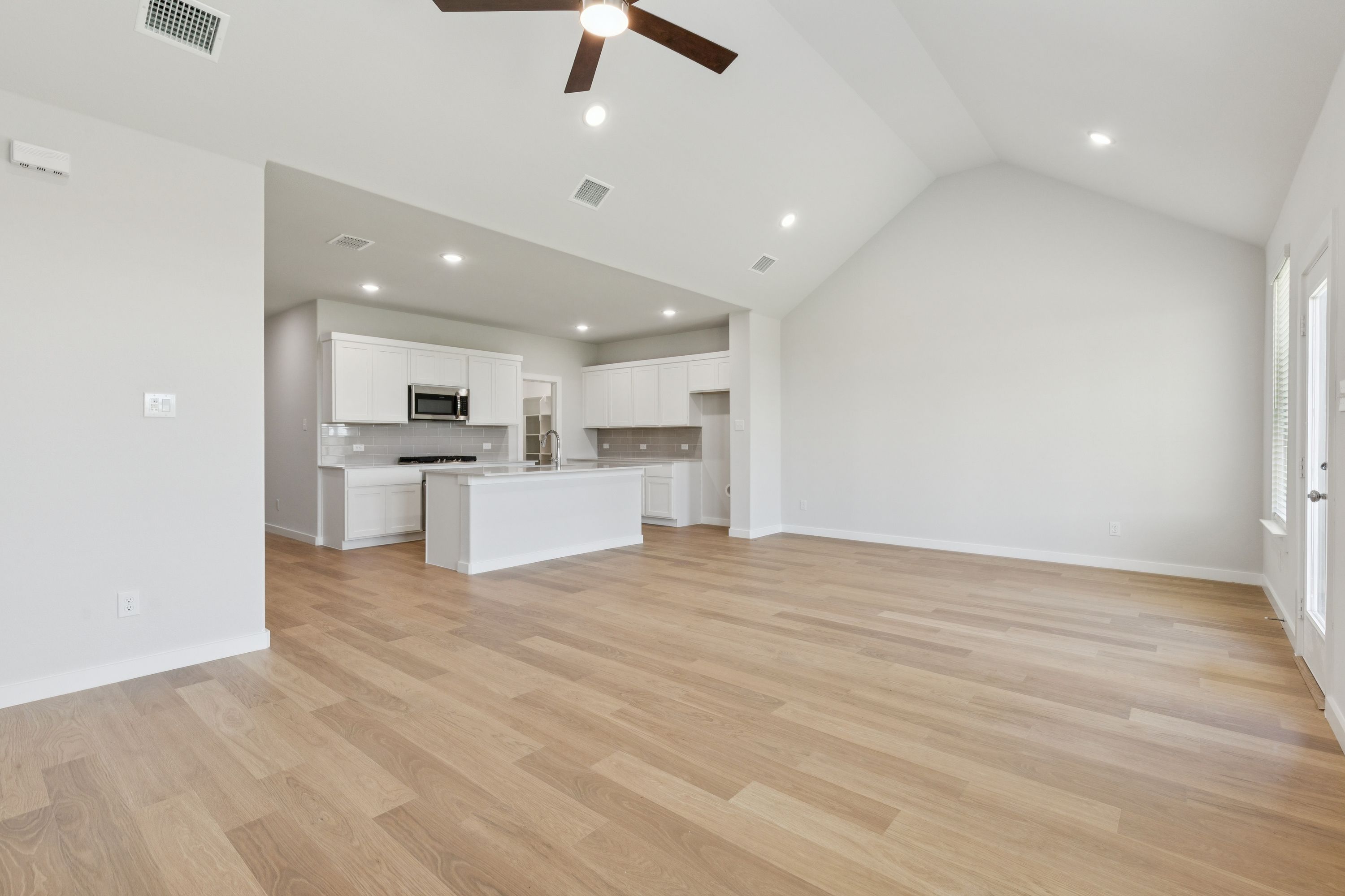 Open first floor in the Masters home plan by Trophy Signature Homes – REPRESENTATIVE PHOTO