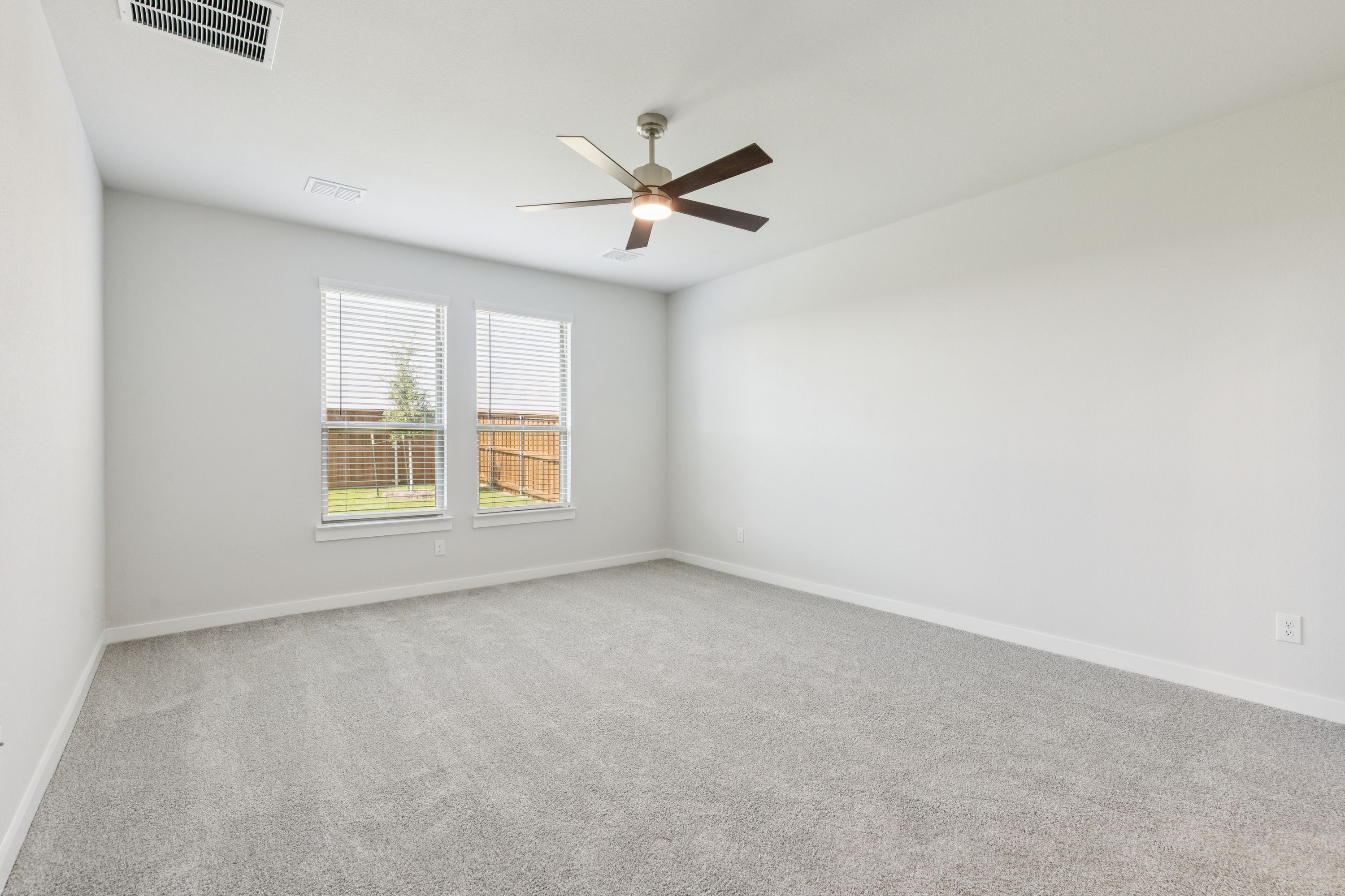 Primary Suite in the Masters home plan by Trophy Signature Homes – REPRESENTATIVE PHOTO