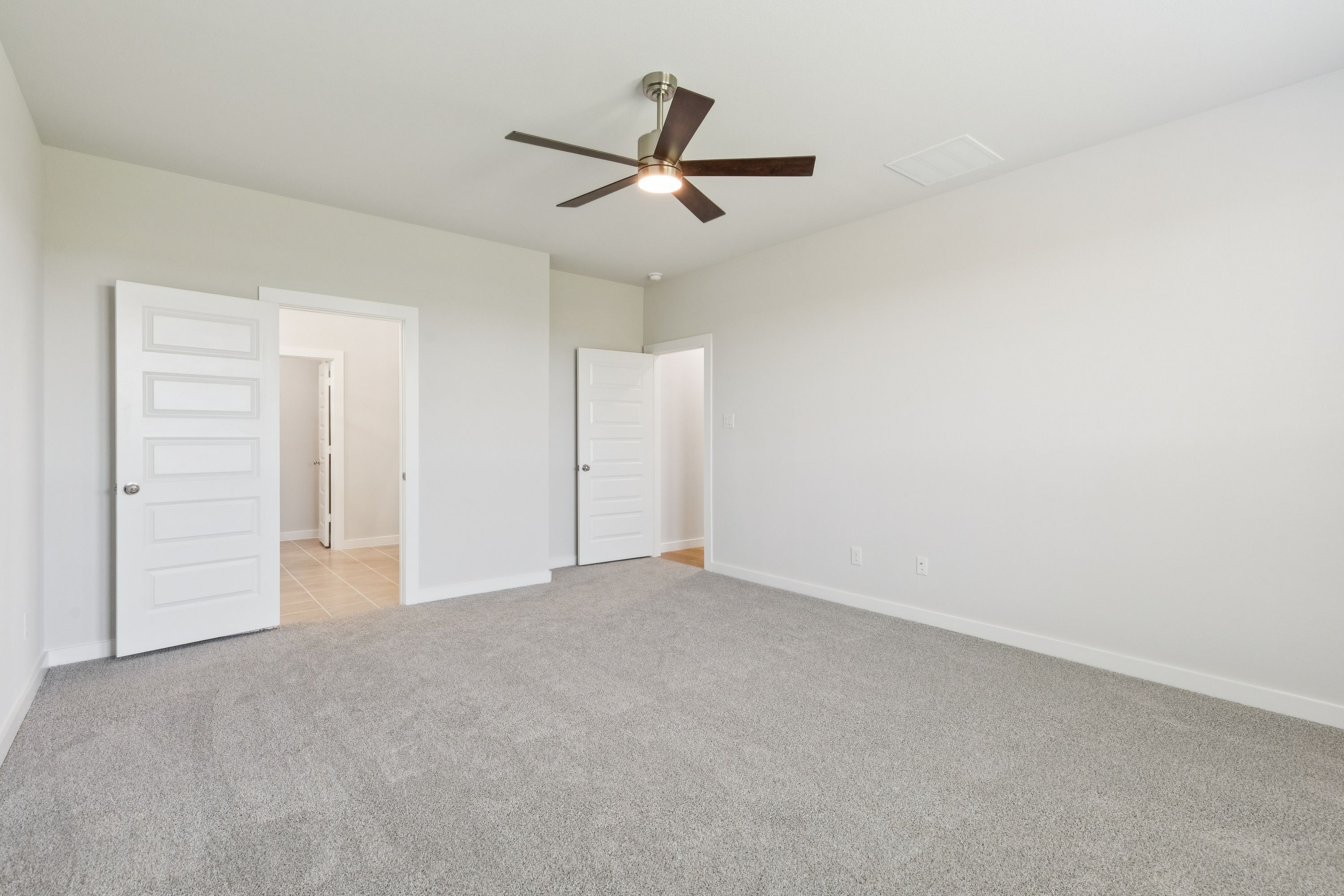 Primary Suite in the Masters home plan by Trophy Signature Homes – REPRESENTATIVE PHOTO